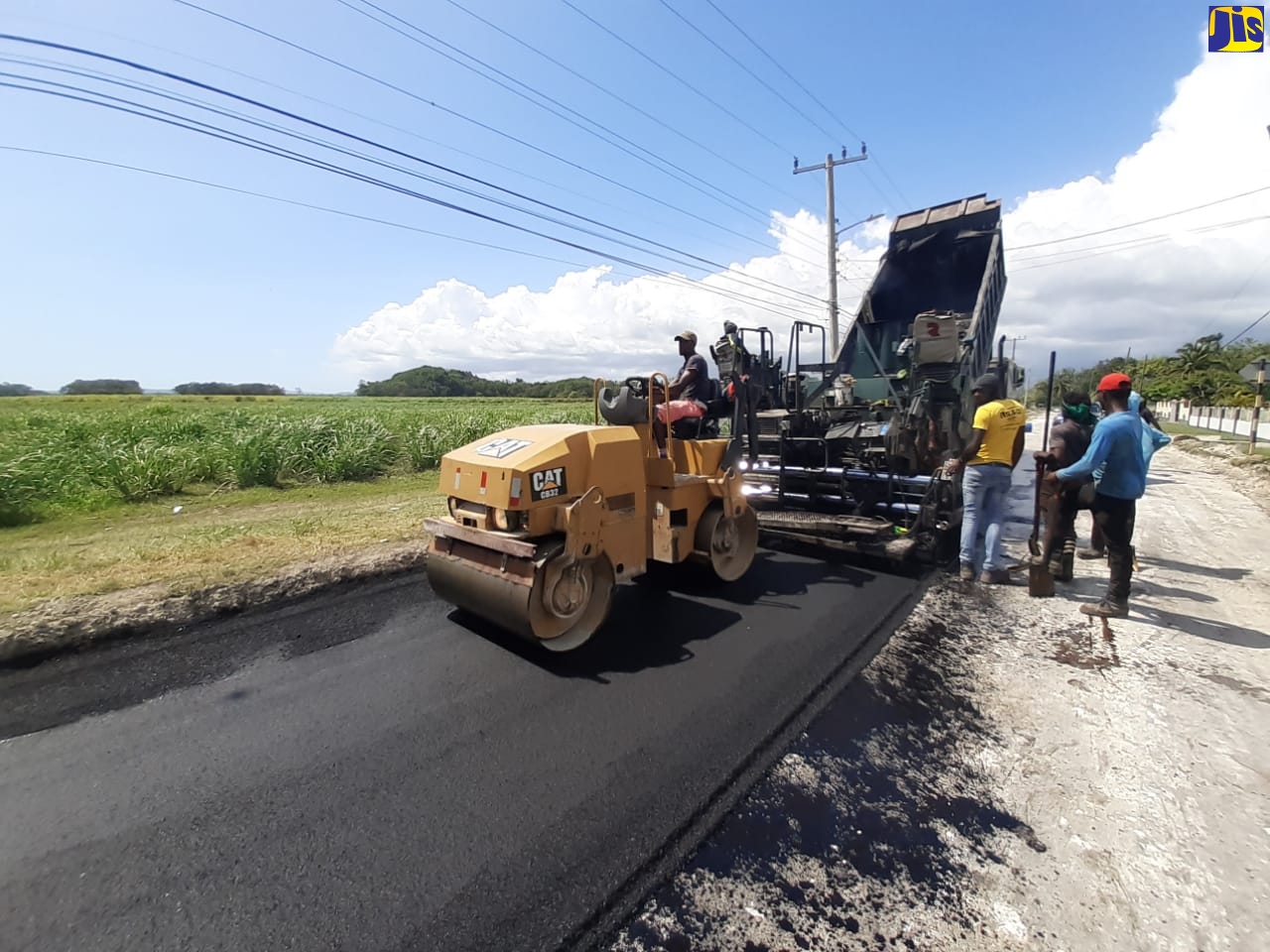 National Works Agency (NWA) workmen repair a section of the George’s Plain roadway in Westmoreland.