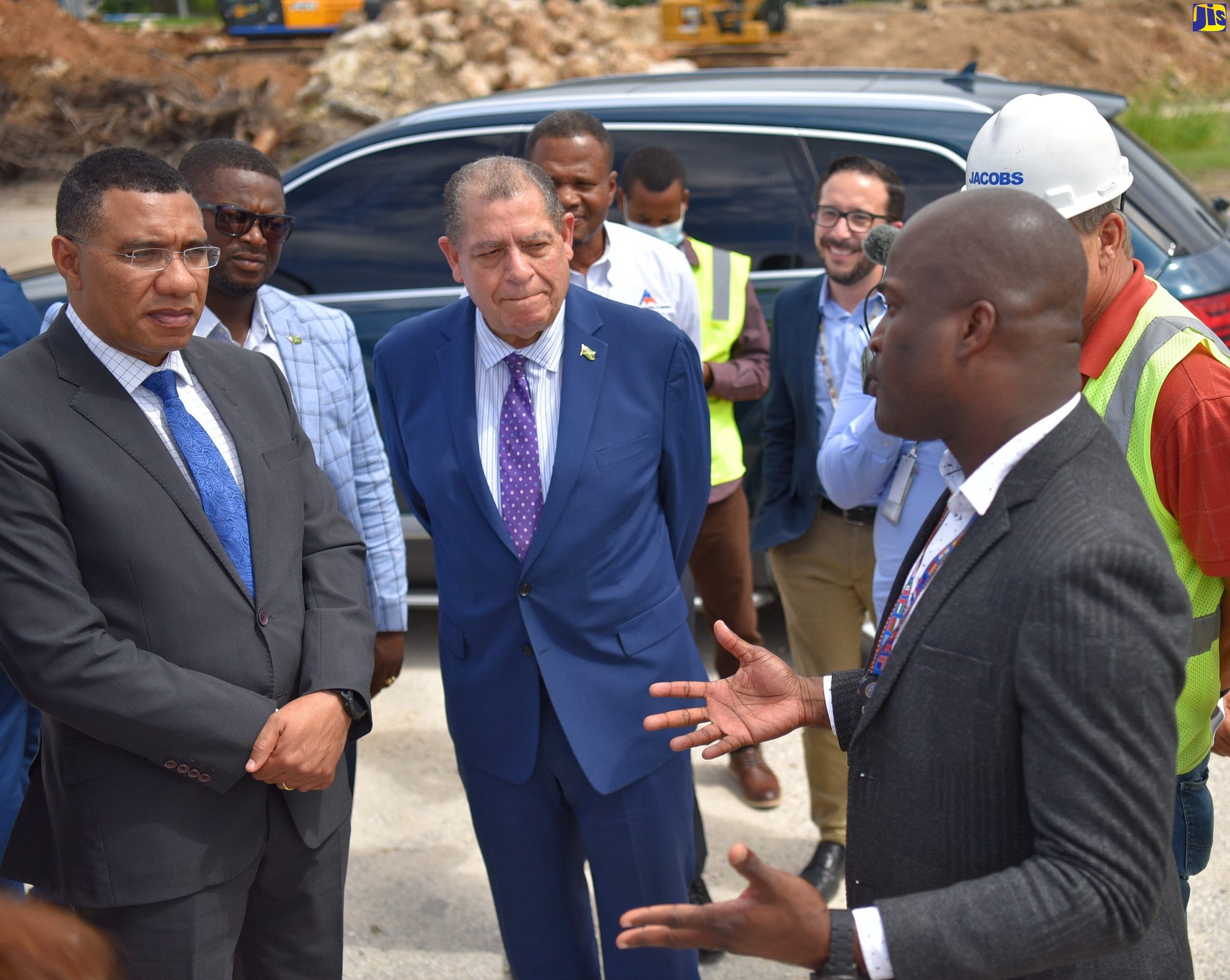 Prime Minister the Most Hon. Andrew Holness (left), listens keenly to the comments of Chief Executive Officer of MBJ Airports Limited, Shane Munro (right), during a tour of the Sangster International Airport in Montego Bay, St. James on May 13. Looking on (from second left) are Member of Parliament for Central St. James, Heroy Clarke, and Minister of Transport and Mining, Hon. Audley Shaw.
