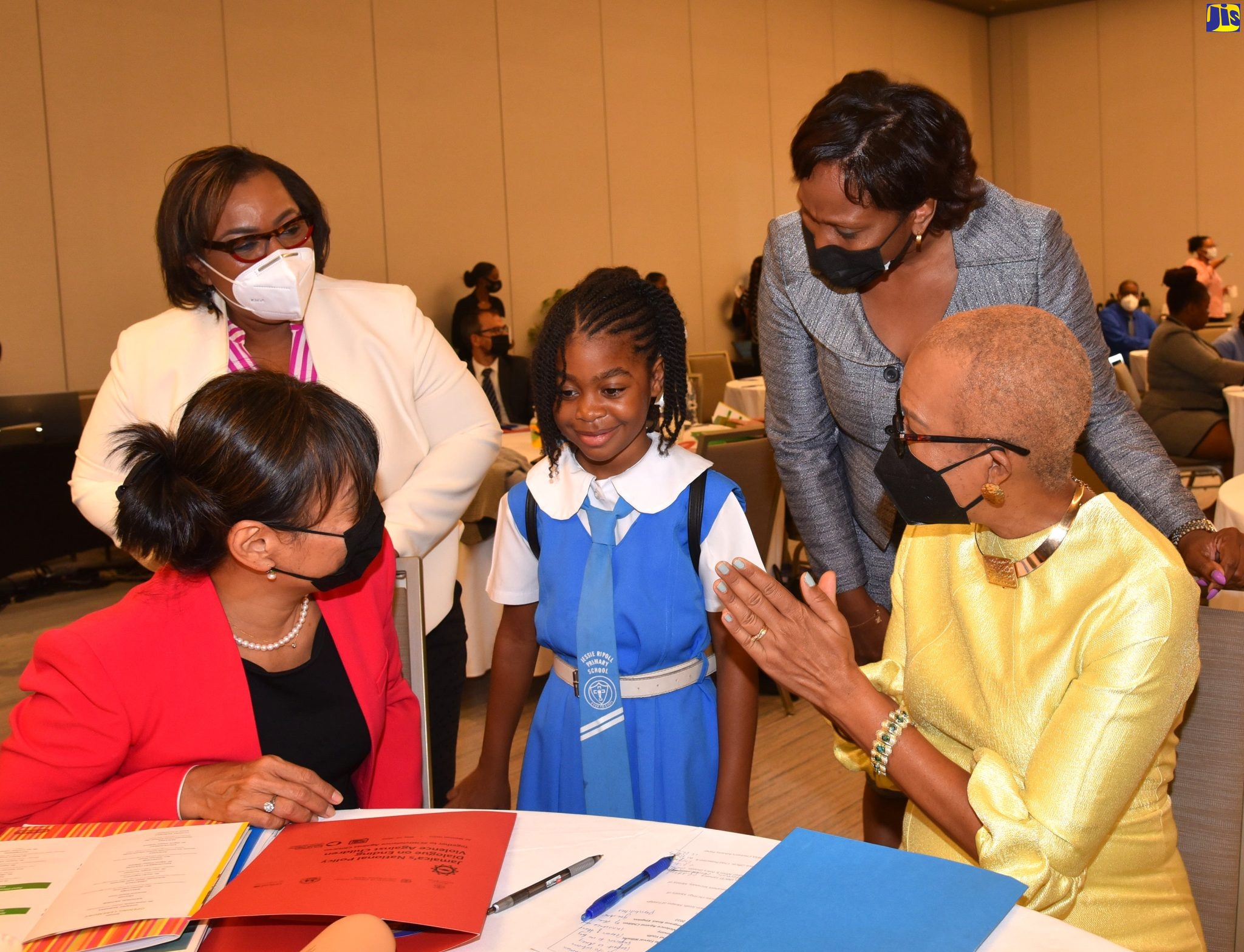 Nine year old Ngozi Wright (center) engages in conversation with (from right) Minister of Education and Youth Hon. Fayval Williams, Children’s Advocate and National Rapporteur on Trafficking in Persons Diahann Gordon Harrison, Chief Executive Officer, Child Protection and Family Services Agency, Rosalee Gage Grey and UNICEF Representative Mariko Kagoshima. Occasion was the opening ceremony for the National Policy Dialogue on Ending Violence Against Children at the AC Marriot Hotel in Kingston on Wednesday (May 25).