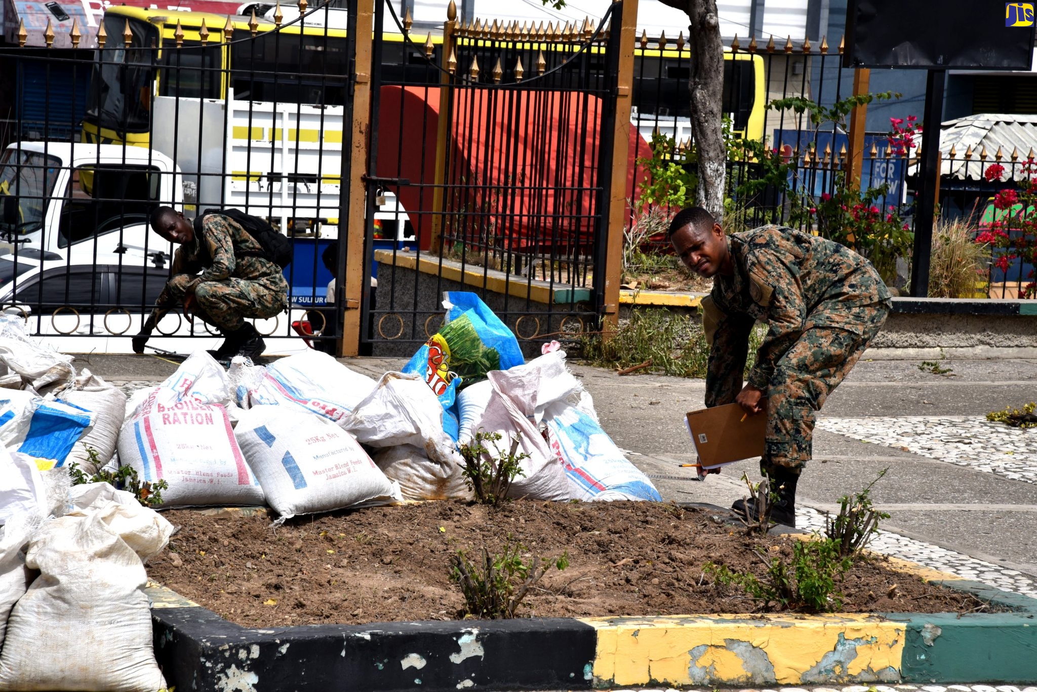 Jamaica Defence Force (JDF) soldiers engage in preparatory work at the Mandela Park, Half-Way Tree, the site selected for the National Labour Day project. Also engaged are workers from the National Solid Waste Management Authority. Labour Day will be observed on Monday, May 23 under the theme ‘Re-igniting a Nation for Greatness – Protect our Heritage and Environment’.