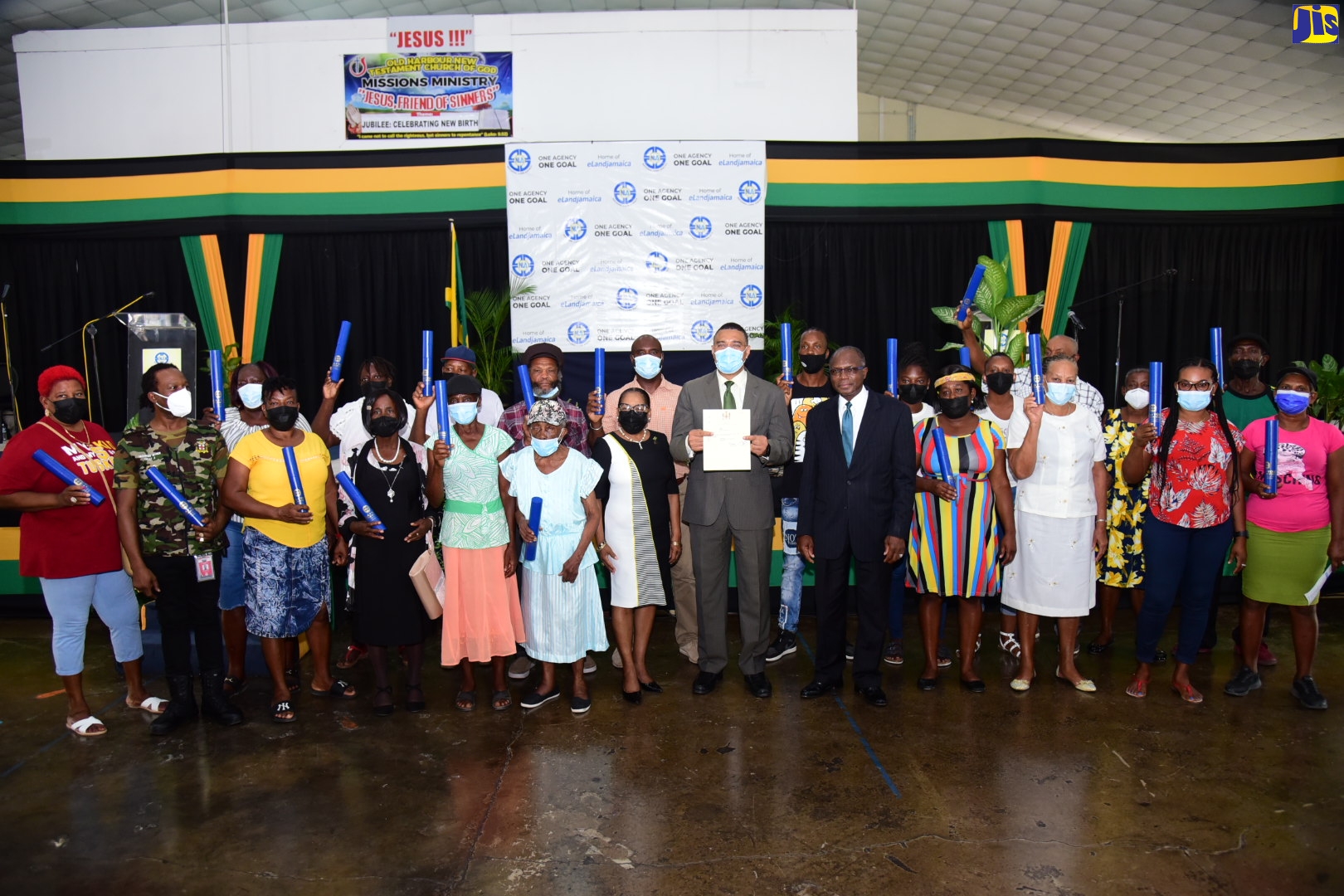 Prime Minister, the Most Hon. Andrew Holness (front row, sixth right), shares a moment with new landowners in St. Catherine who have received certificates of title under the National Land Agency (NLA) Systematic Land Registration (SLR) Programme. The handover ceremony was held on Wednesday (June 1) at the Old Harbour New Testament Church of God in Rhoden's Pen. Also sharing in the occasion are Minister without Portfolio in the Ministry of Economic Growth and Job Creation, Hon. Everald Warmington (front row, fifth right); and Custos of St. Catherine, Icylin Golding (front row, seventh right). 