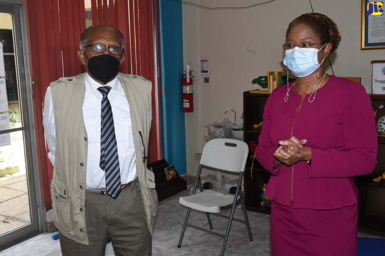 Chairman of the Jamaica Education Transformation Commission (JETC) report, Professor Orlando Patterson (left), enters the offices of the Early Childhood Commission (ECC),  downtown Kingston, on Monday (June 6). Pictured at right is Executive Director of the agency, Karlene DeGrasse-Deslandes.