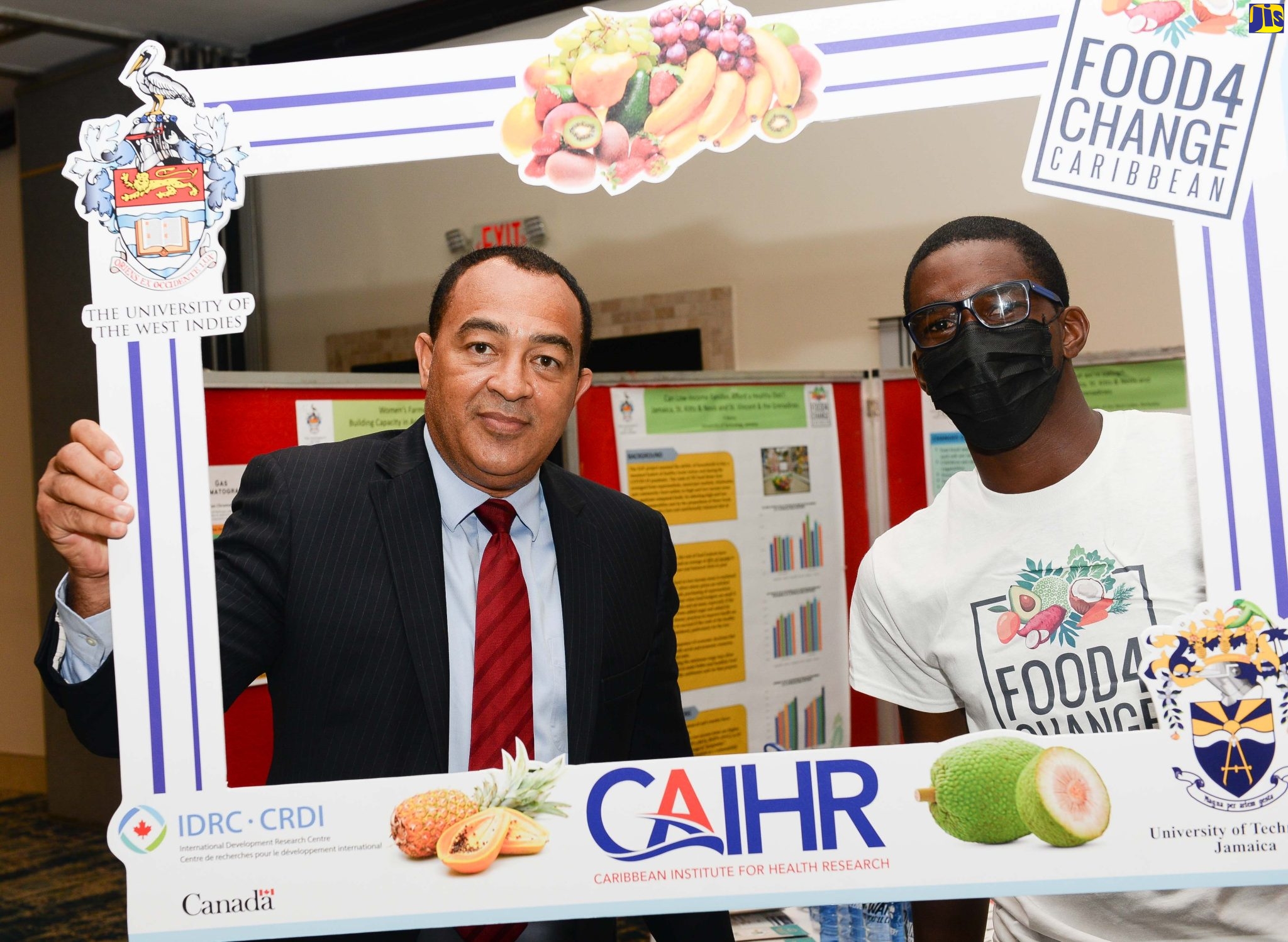 Health Minister, Dr. the Hon. Christopher Tufton (left), pauses for a photo with Food 4 Change representative, Jordan Dressikie, at the closing ceremony for the Food and Nutrition (FaN) Caribbean project and launch of the Jamaica Council of Churches sermon series, at The Jamaica Pegasus hotel on Tuesday (June 14).