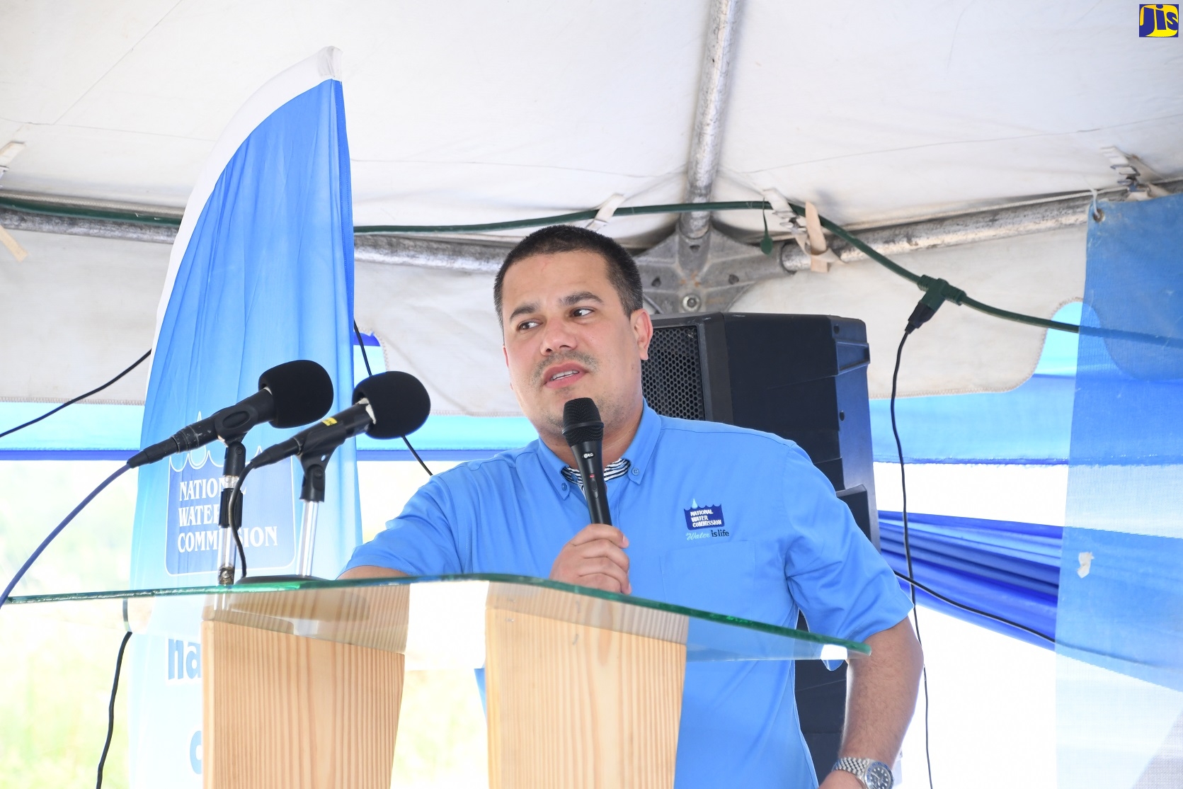 Minister without portfolio in the Ministry of Economic Growth and Job Creation, Senator the Hon Matthew Samuda, addresses a ceremony to commission into service, the 100,000-gallon West Gate Hills number-2 storage replacement tank in West Gate Hills, St. James, on June16.