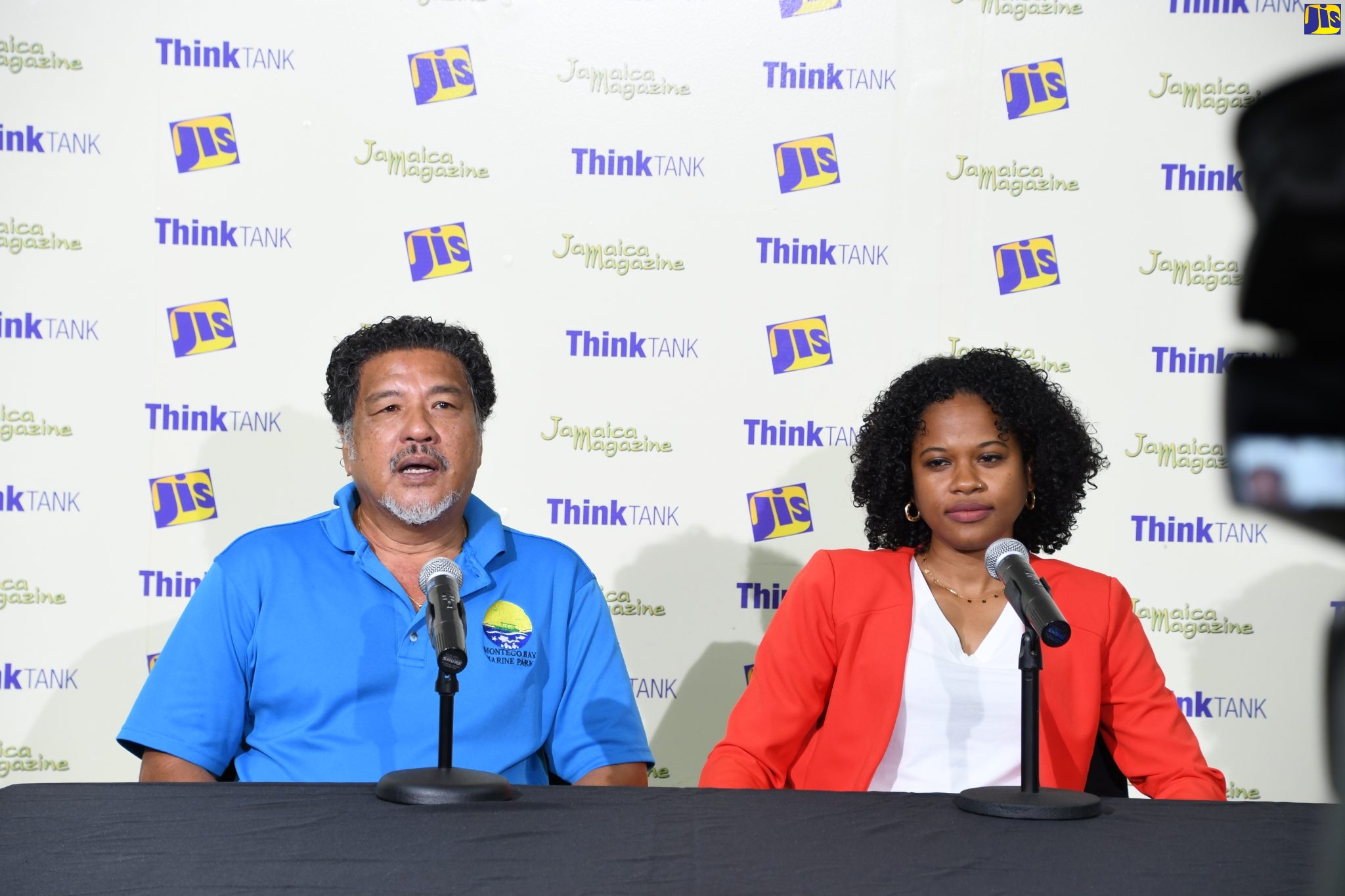 Executive Director of the Montego Bay Marine Park Trust in St. James, Hugh Shim (left), addresses a Jamaica Information Service (JIS) ‘Think Tank’, at the agency’s Regional Office in Montego Bay, on June 28. Listening is Lecturer of Philosophy in the Department of Language, Linguistics and Philosophy at the University of the West Indies (UWI), Mona, Khimaja Connell.