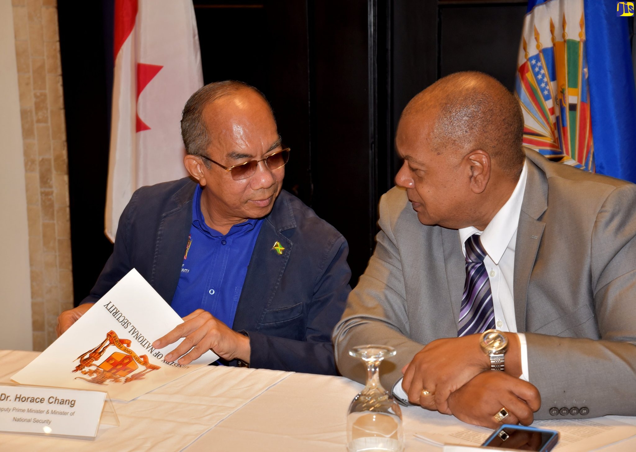 Minister of National Security, Hon. Dr. Horace Chang (left), and Executive Director, National Council on Drug Abuse (NCDA), Michael Tucker, in conversation at the opening of the Organization of American States (OAS): Inter American Drug Abuse Control Commission (CICAD) training workshop on monitoring, and evaluation of national drug policies, strategies and plans, on June 15, at The Jamaica Pegasus hotel in Kingston.