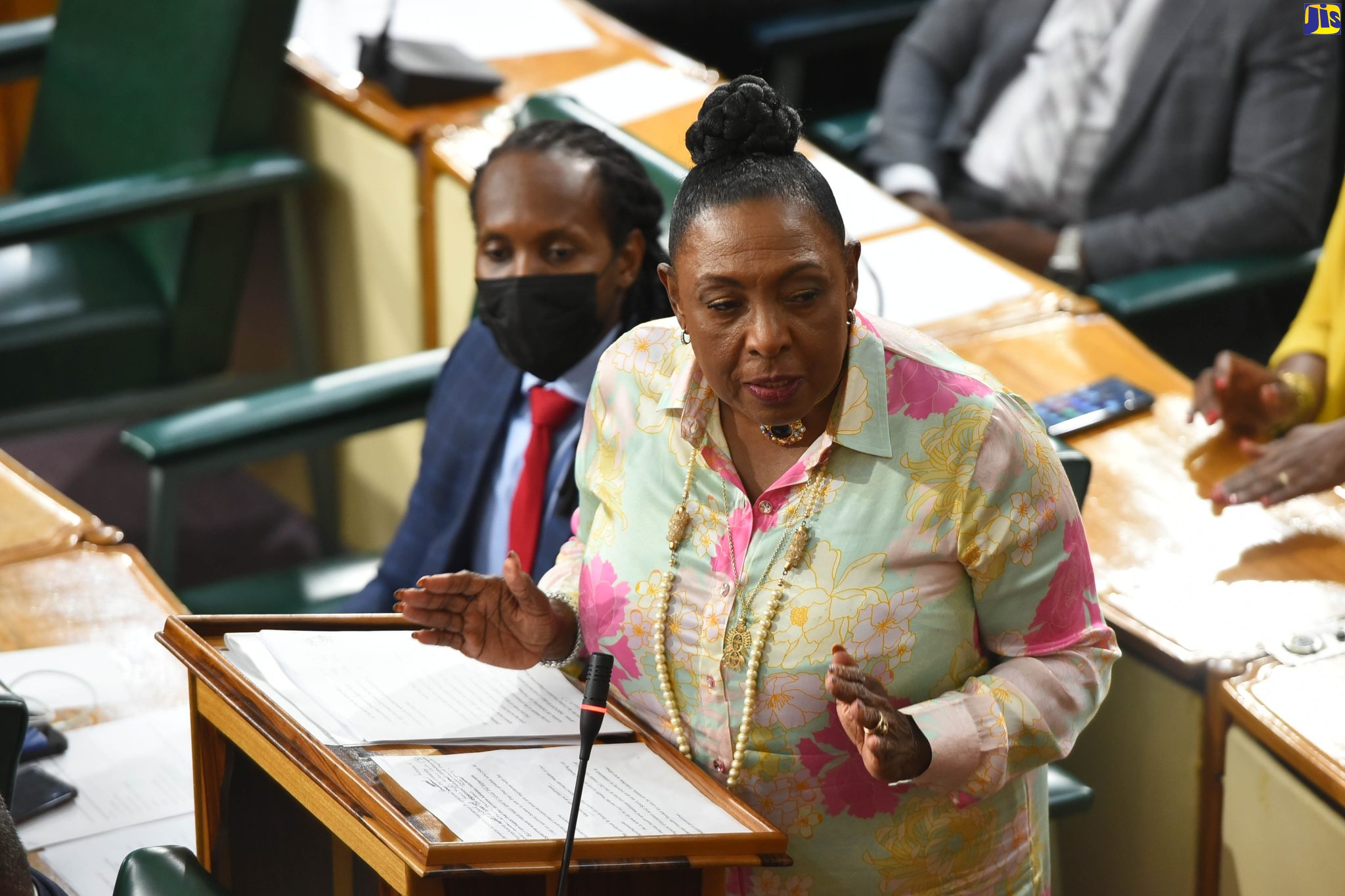 Minister of Culture, Gender, Entertainment and Sport, Hon. Olivia Grange, makes her contribution to the 2022/23 Sectoral Debate in the House of Representatives on Wednesday (June 8). Listening at left is Minister of State in the Ministry, Hon. Alando Terrelonge.  

