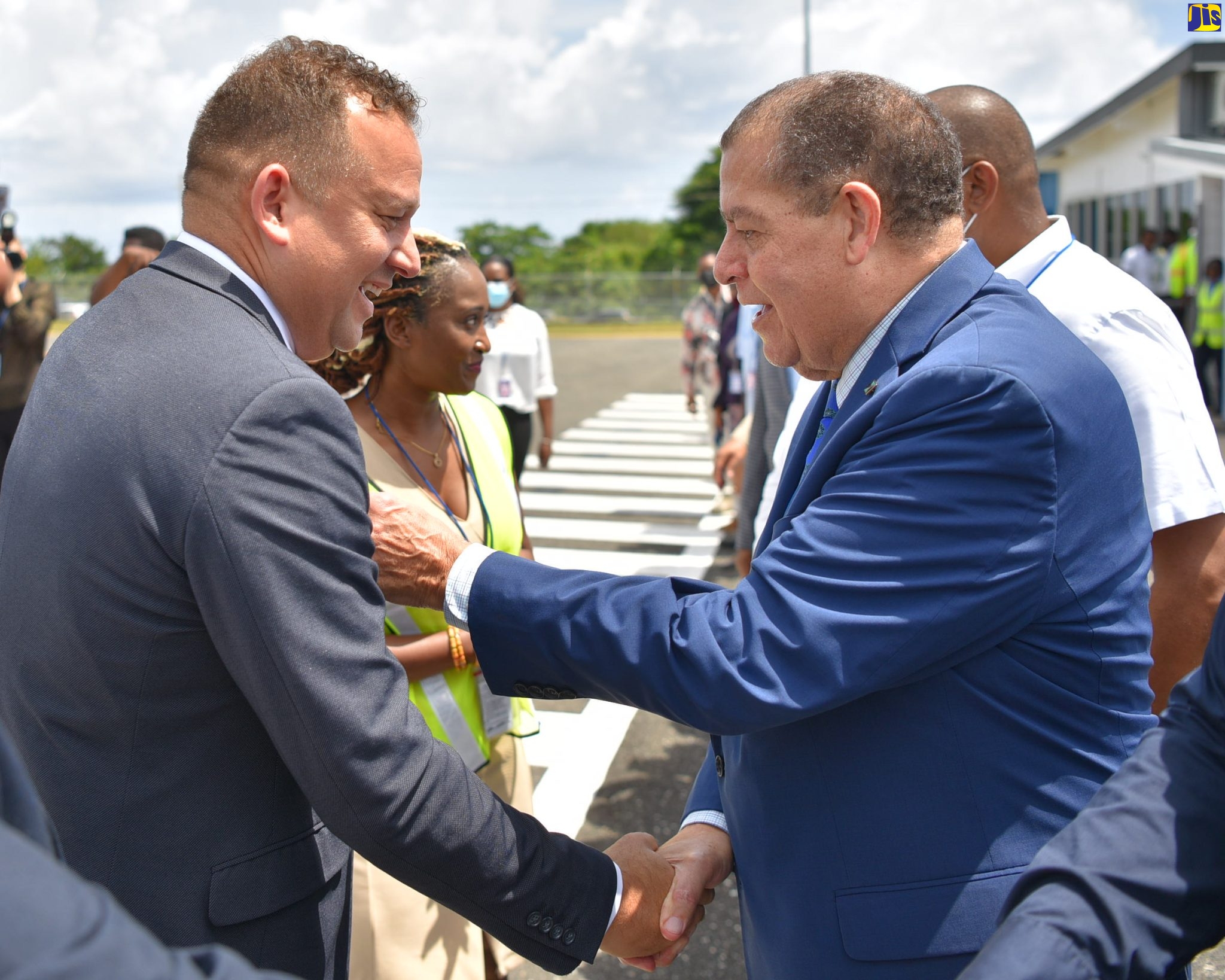 Minister of Transport and Mining, Hon. Audley Shaw (right), greets Consul General of Jamaica in Miami, Oliver Mair, at the official ceremony to welcome the arrival of the inaugural flight of Quality Corporate Aircraft Services (QCAS) Aero, out of Fort Lauderdale, at the Ian Fleming International Airport in St. Mary, on June 22. The Miami-based QCAS Aero will operate an exclusive, premium nonstop weekly flight to the airport.