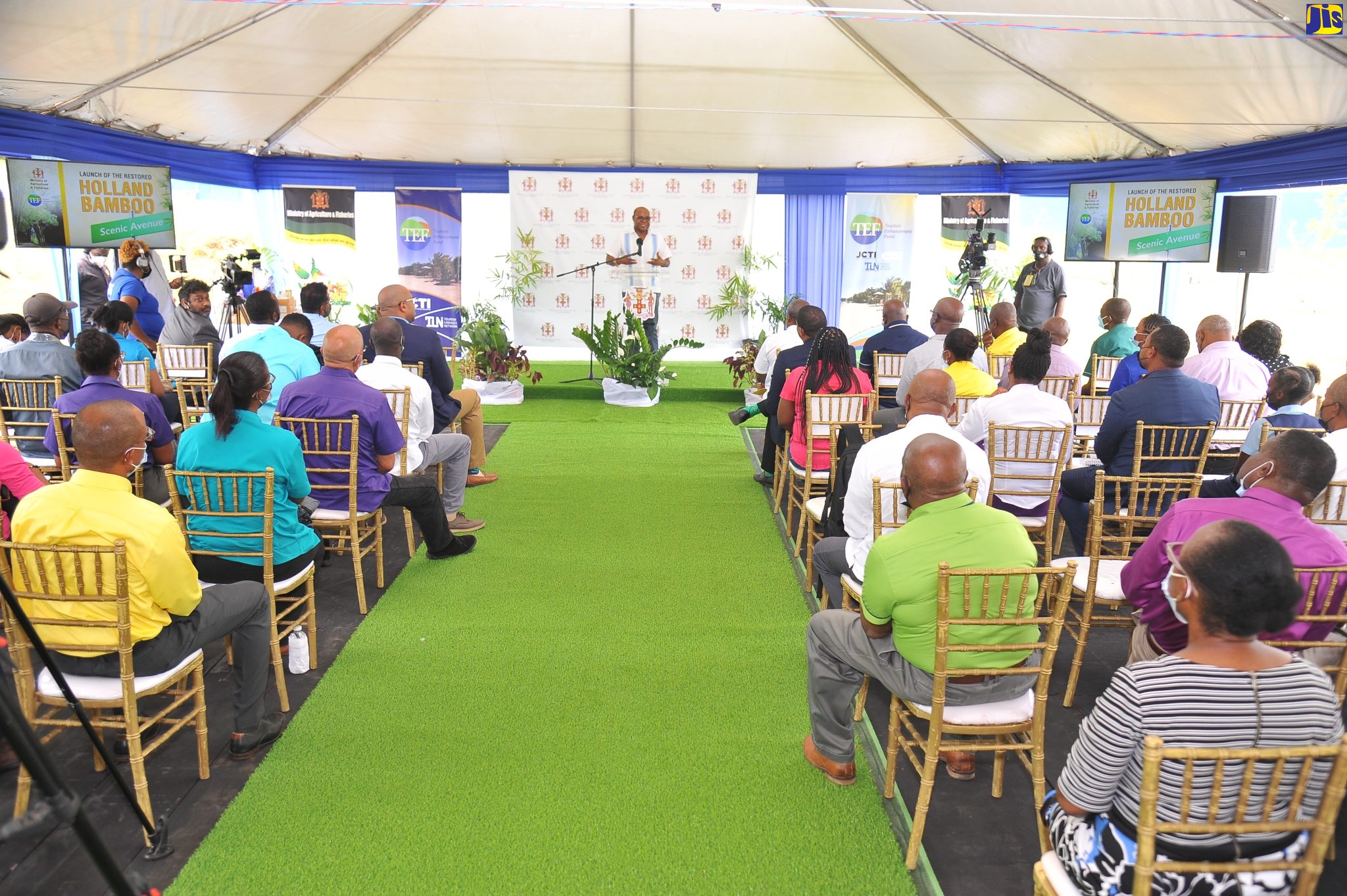 Tourism Minister, Hon. Edmund Bartlett, addresses a ceremony for the official opening of the Holland Bamboo Scenic Avenue in St. Elizabeth held at the Holland Bamboo Primary School on June 2. The site was restored at a cost of $8.5 million.