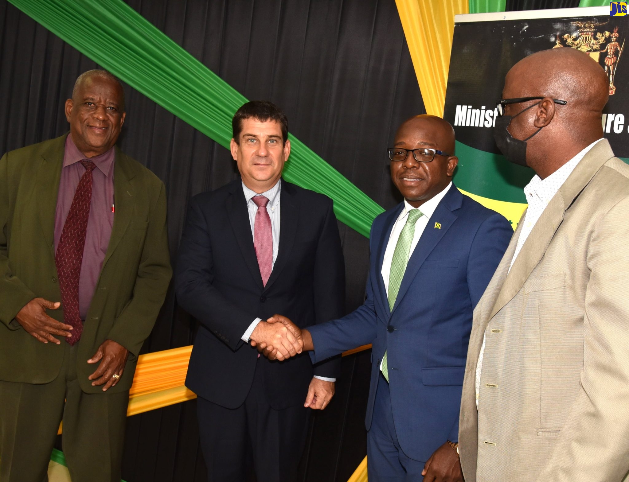 Agriculture and Fisheries Minister, Hon. Pearnel Charles Jr (second right), shakes hands with Ambassador of the Republic of Cuba, His Excellency Fermin Quinones (second left), ), during a courtesy call on Tuesday, (May 31) at the Ministry’s Kingston offices. Looking on are State Minister, Hon. Franklin Witter (left) and Chief Technical Director, Orville Palmer. 

