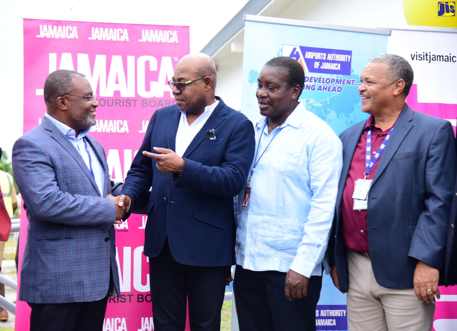 Tourism Minister, Hon. Edmund Bartlett (second from left), greets interCaribbean Airways Chairman,  Lyndon Gardiner, during a welcome ceremony for the inaugural scheduled commercial flight into the Ian Flemming International Airport on Thursday, June 16. Also in photo are Member of Parliament for St Mary Western,  Robert Montague (third from left) and Airports Authority of Jamaica (AAJ) President, Audley Deidrick.