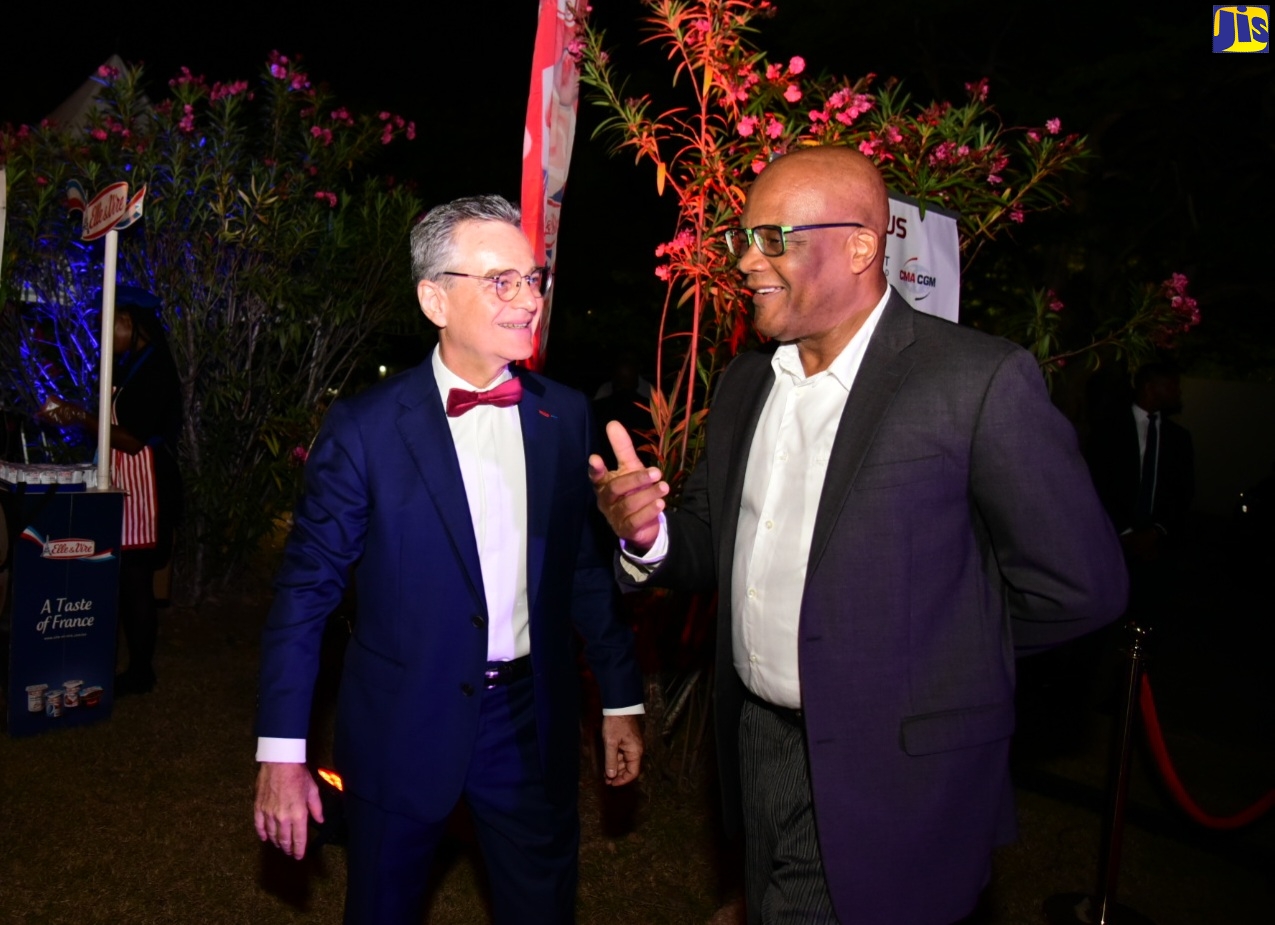 State Minister in the Ministry Foreign Affairs and Foreign Trade, Senator the Hon. Leslie Campbell (right), engages in discussion with French Ambassador to Jamaica, His Excellency Olivier Guyonvarch, during a reception held at the French Embassy in St. Andrew on Thursday (July 14) to commemorate the 60th Anniversary of Diplomatic Relations between Jamaica and France and to celebrate the French National Day “Bastille Day”.