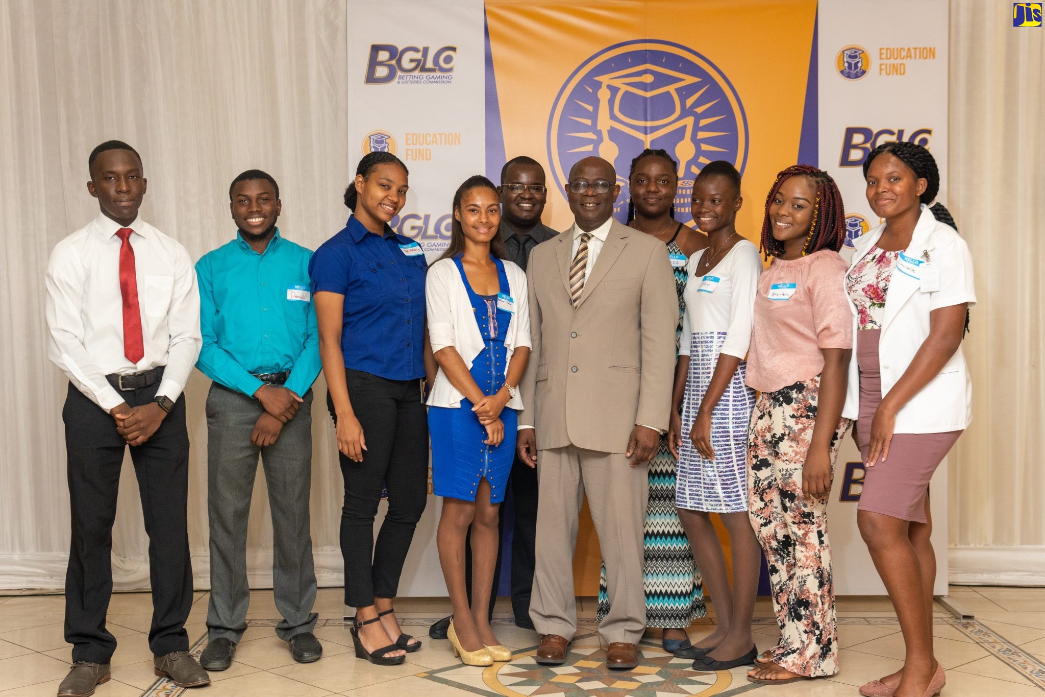 Executive Director, Betting, Gaming and Lotteries Commission (BGLC), Vitus Evans (5th left) with past recipients of the BGLC Tertiary Education Grant.