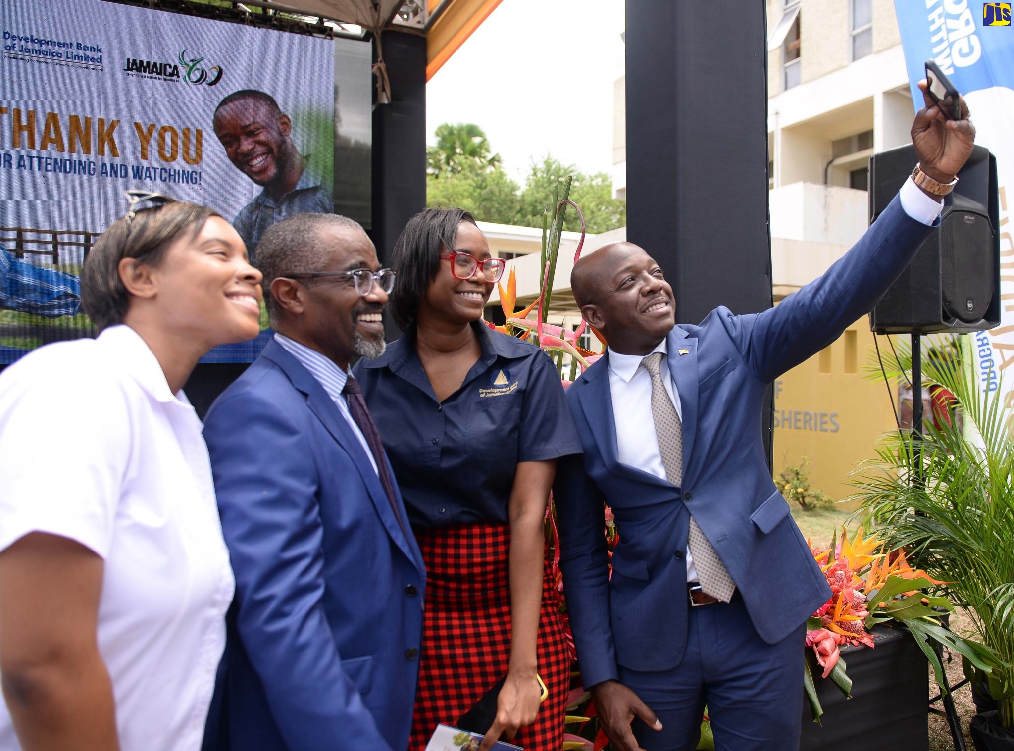 Minister of Agriculture and Fisheries, Hon. Pearnel Charles Jr. (right), takes a selfie with, from left, Representative from Everything Grand Ideas, Nikolette Williams; Managing Director, Development Bank of Jamaica (DBJ), M. Anthony Shaw; and Marketing Manager, DBJ, Trisann Crosbie. Occasion was during the launch of the DBJ’s  ‘AgriBiz’ facility  at the Ministry’s Hope Gardens Complex in Kingston on Tuesday (July 19).