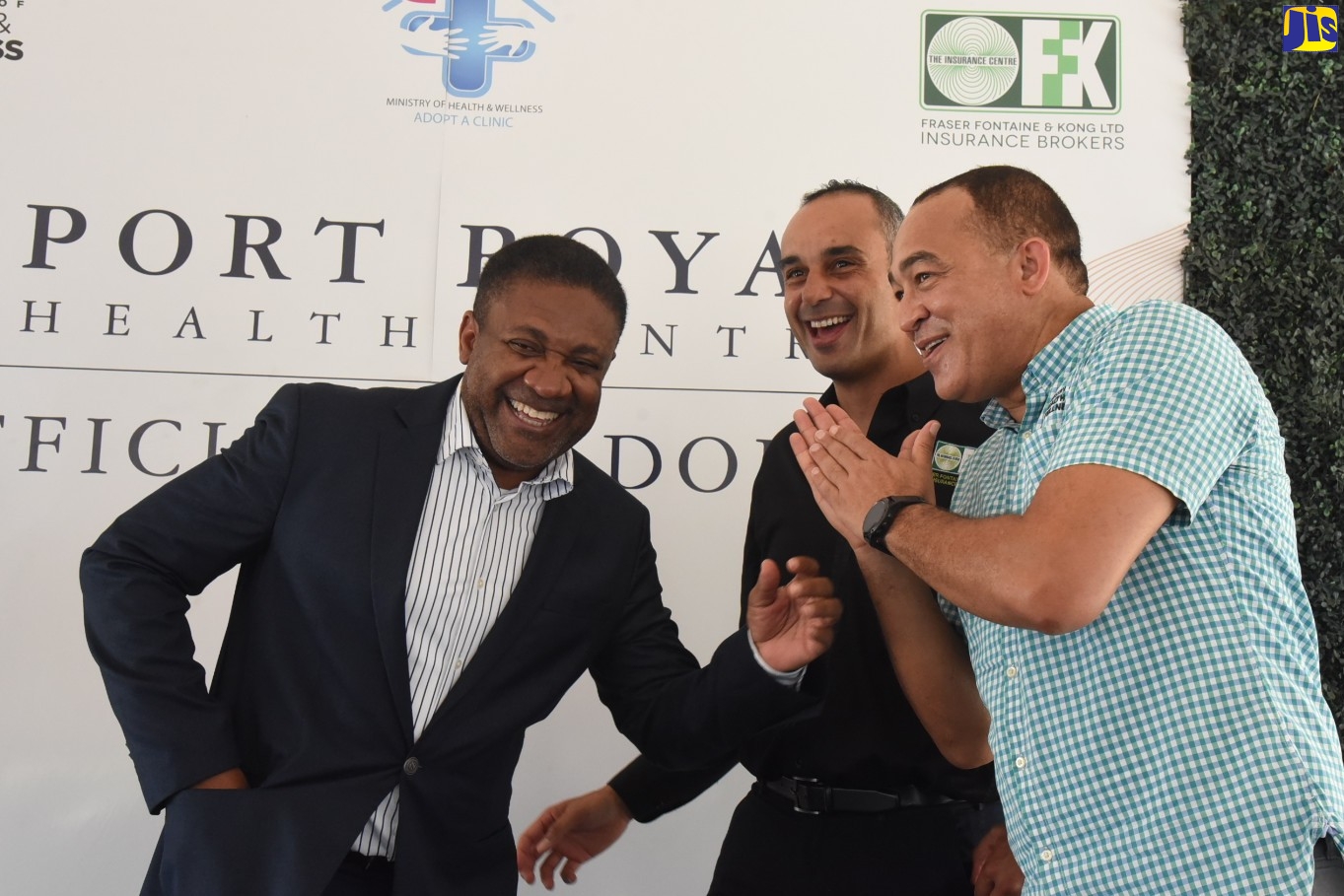 Minister of Health and Wellness, Dr. the Hon Christopher Tufton (right), shares a light moment with Member of Parliament for Kingston East and Port Royal, Phillip Paulwell (left) and President of Fraser Fontaine and Kong Insurance Brokers Ltd. (FFK), Gerard Fontaine, at the adoption ceremony for the Port Royal Health Centre on July 7.