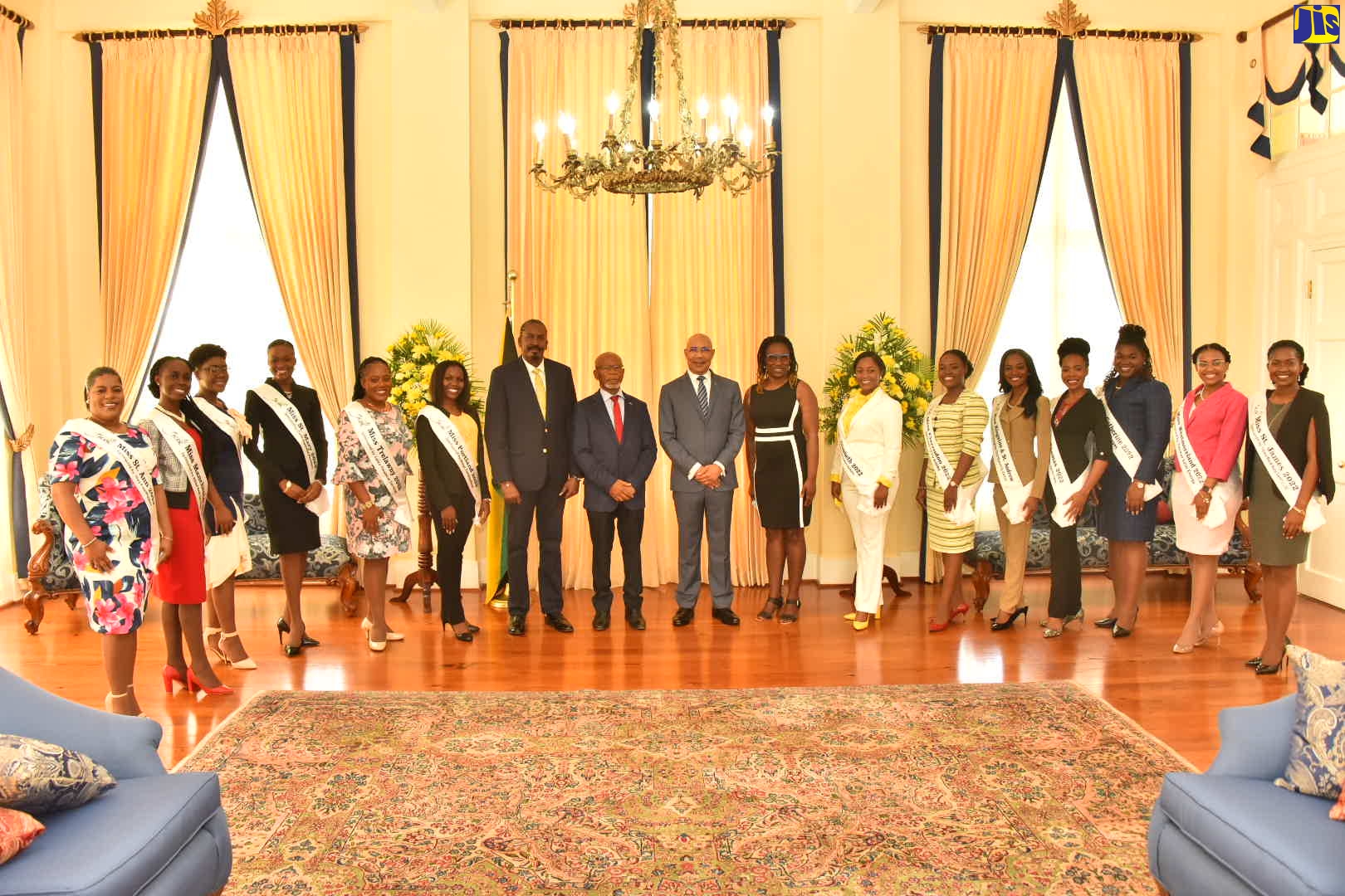 Governor-General, His Excellency the Most Hon. Sir Patrick Allen (centre), is joined by the 2022 Miss Jamaica Festival Queen finalists during a courtesy call at Kings House on Monday (July 25). Also joining are National Festival Queen Consultant, Michael Nicholson (seventh left), National Festival Queen Committee Chairman, Silvera Castro (eighth left), and Chaperone Major Lucien Suba (eighth right). 