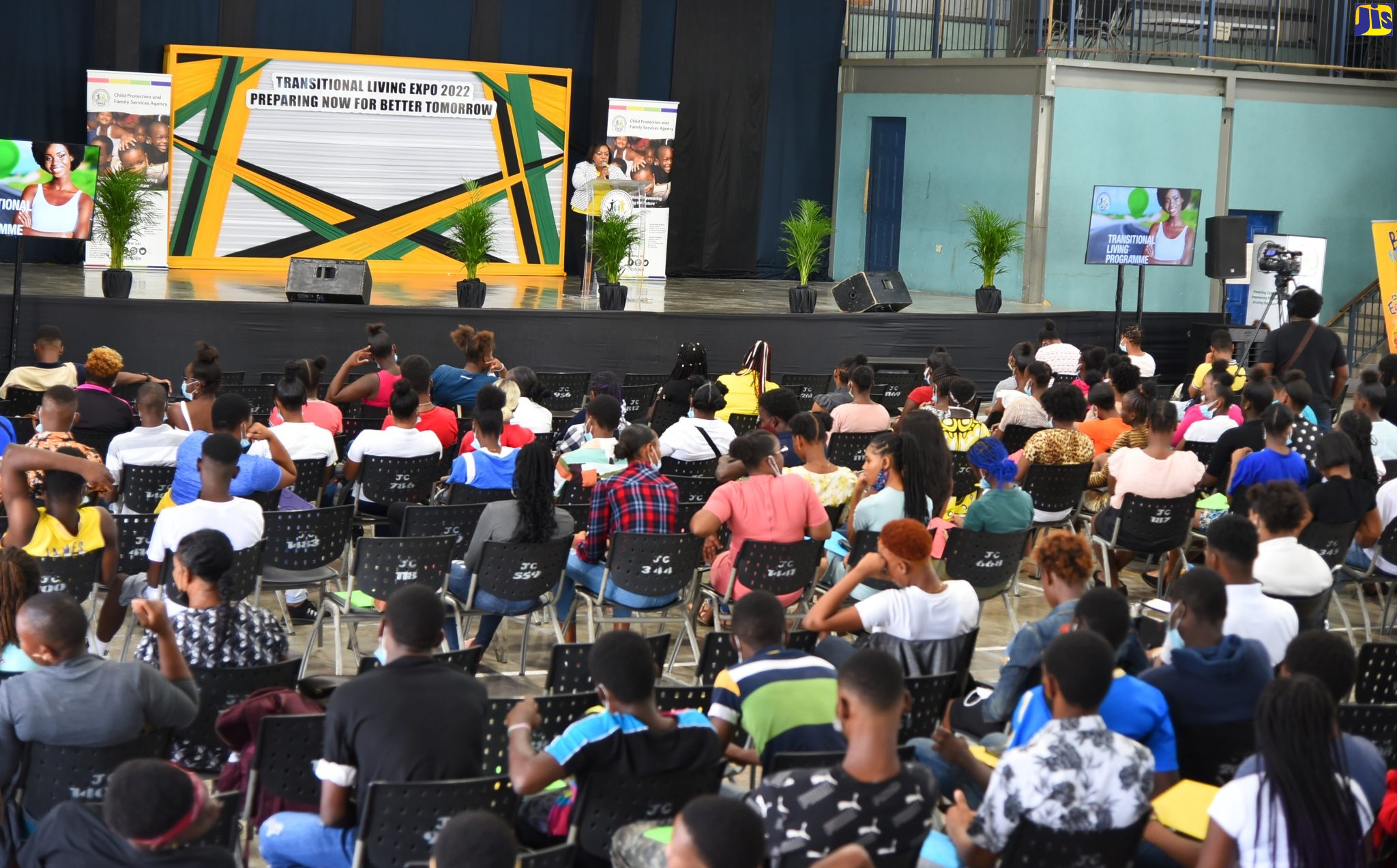 Youth in state care listen as Chief Executive Officer of the Child Protection and Family Agency (CPFSA) Rosalee Gage-Grey, speaks about the Transitional Living Programme (TLP) during the expo held at Jamaica College in St. Andrew on Thursday (July 21).  