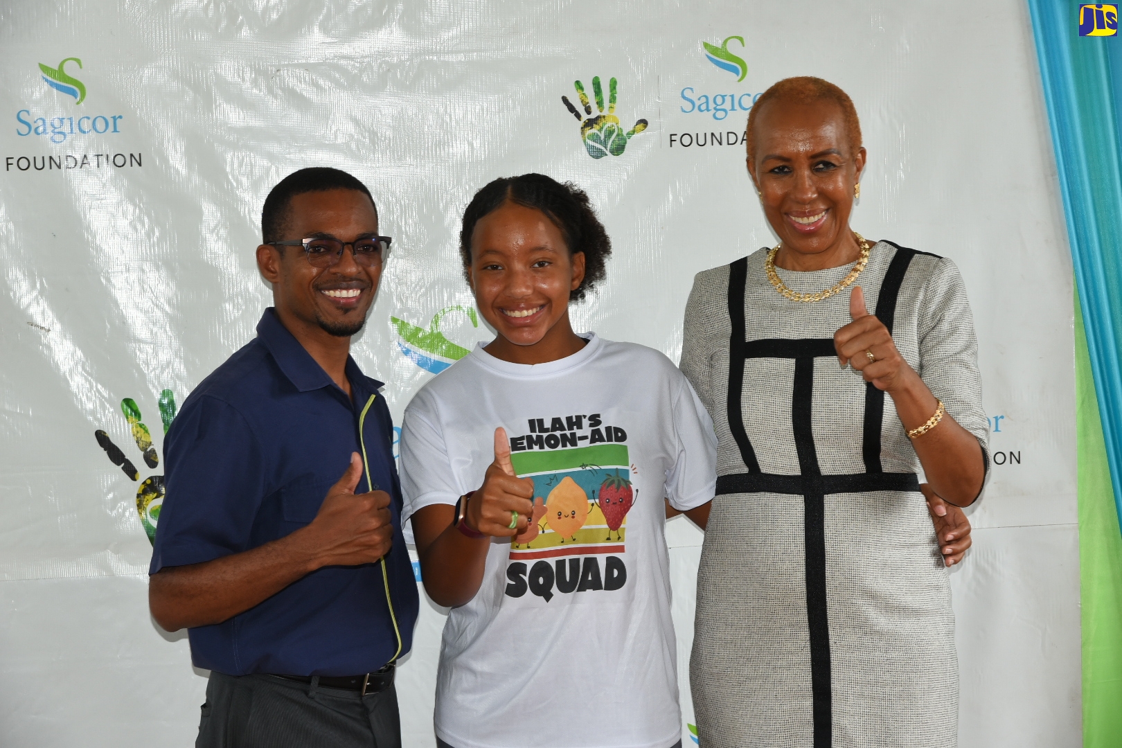 Minister of Education and Youth, Hon. Fayval Williams (right), pauses for a photo with ILAH’s Lemon-Aid Stand For Kids Foundation Founder, Imani-Leigh Hall (centre) and Sagicor Bank Manchester, Branch Manager, Kavon Walker, during a visit to the Foundation’s summer camp at Manchester High School, on Friday (July 22). A donation of $3.5 million from Sagicor has helped the Foundation to stage a three-week literacy and numeracy programme, benefitting over 100 students.
