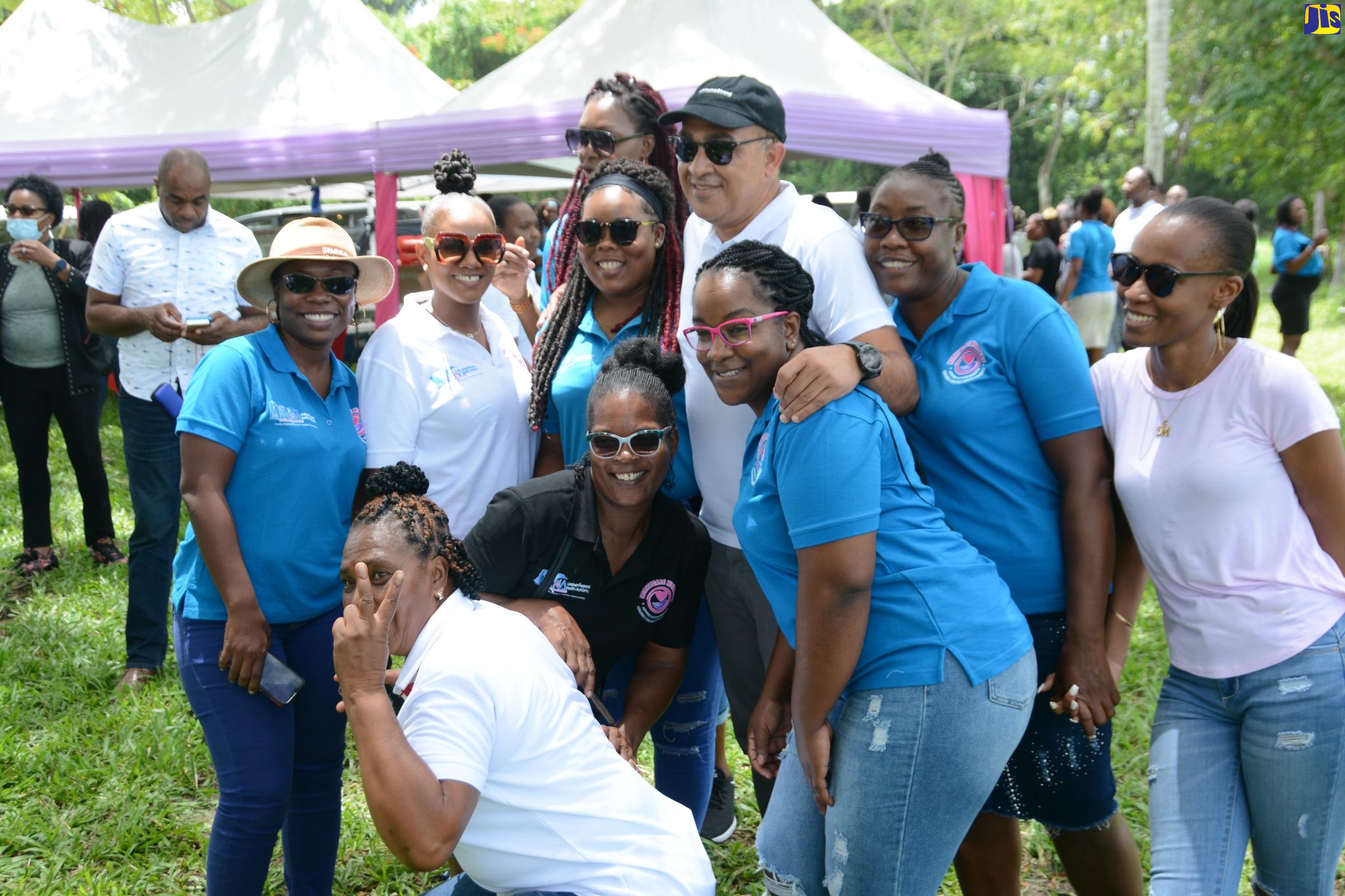 Minister of Health and Wellness, Dr. the Hon. Christopher Tufton, shares a light moment with healthcare workers at the Healthcare Workers Appreciation Day - Western Region Fun Day at Paradise Park by the River in Savanna-la-Mar, Westmoreland, on Wednesday (July 13). 