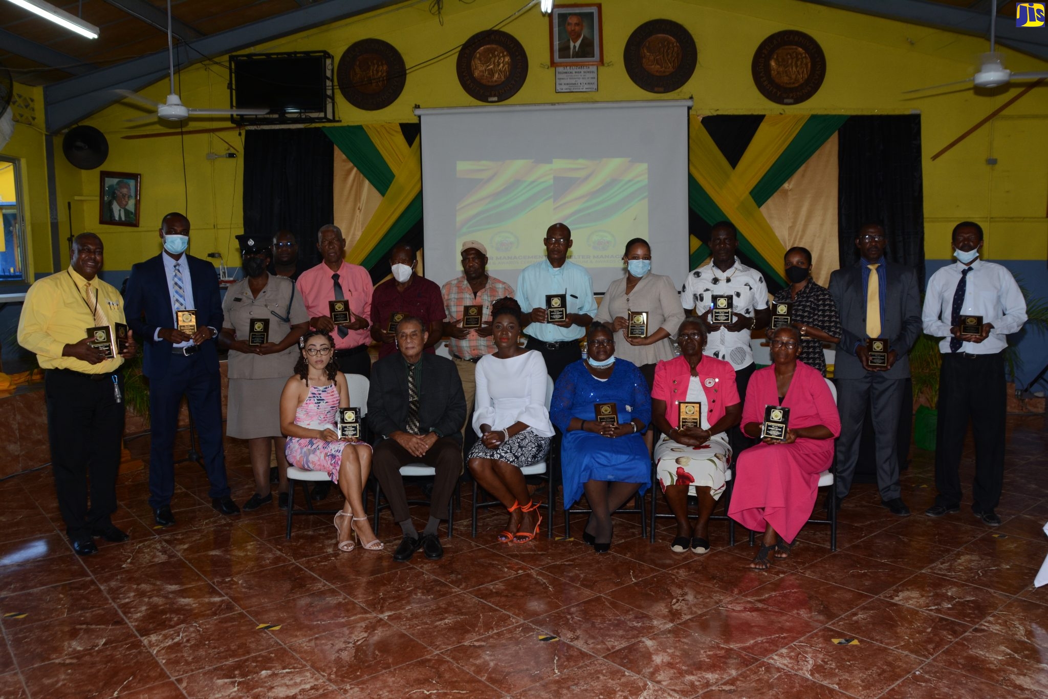 Mayor of Black River, Councillor Derrick Sangster (seated, second from left), and Parish Coordinator for Disaster Preparedness at the St. Elizabeth Municipal Corporation, Ornella Lewis (seated, third from left), with Shelter Managers who were honoured  during a Shelter Management Symposium & Awards Ceremony at the St. Elizabeth Technical High School in Santa Cruz, on Thursday (July 21).