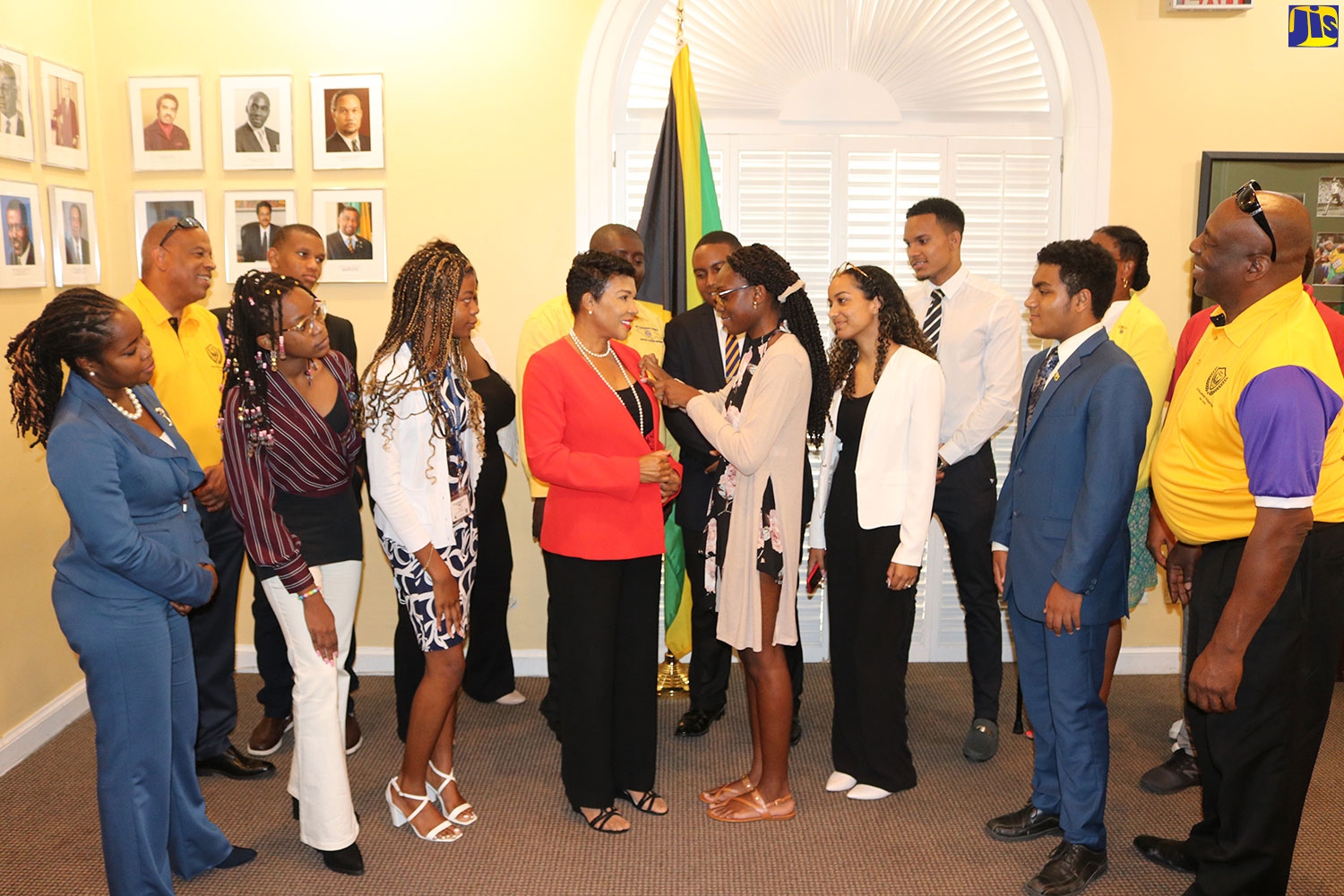 Jamaica’s Ambassador to the United States, Audrey Marks (fourth left, foreground) is being affixed with the distinguished Key Club pin by Jada-Rose Farquharson from Hampton High School of Malvern, St. Elizabeth. Occasion was a courtesy call on Ambassador Marks by Key Clubbities from high schools in Jamaica, at the Jamaican Embassy in Washington DC on Wednesday, July 13. The 11 students, representing Jamaica College, Ardenne, Hampton, Gaynstead, Campion College, Holy Childhood, Kingston College, and Wolmer’s, along with faculty members, were in the US capital city for a Key Club International Convention (ICON), which ran from July 6 to 10.