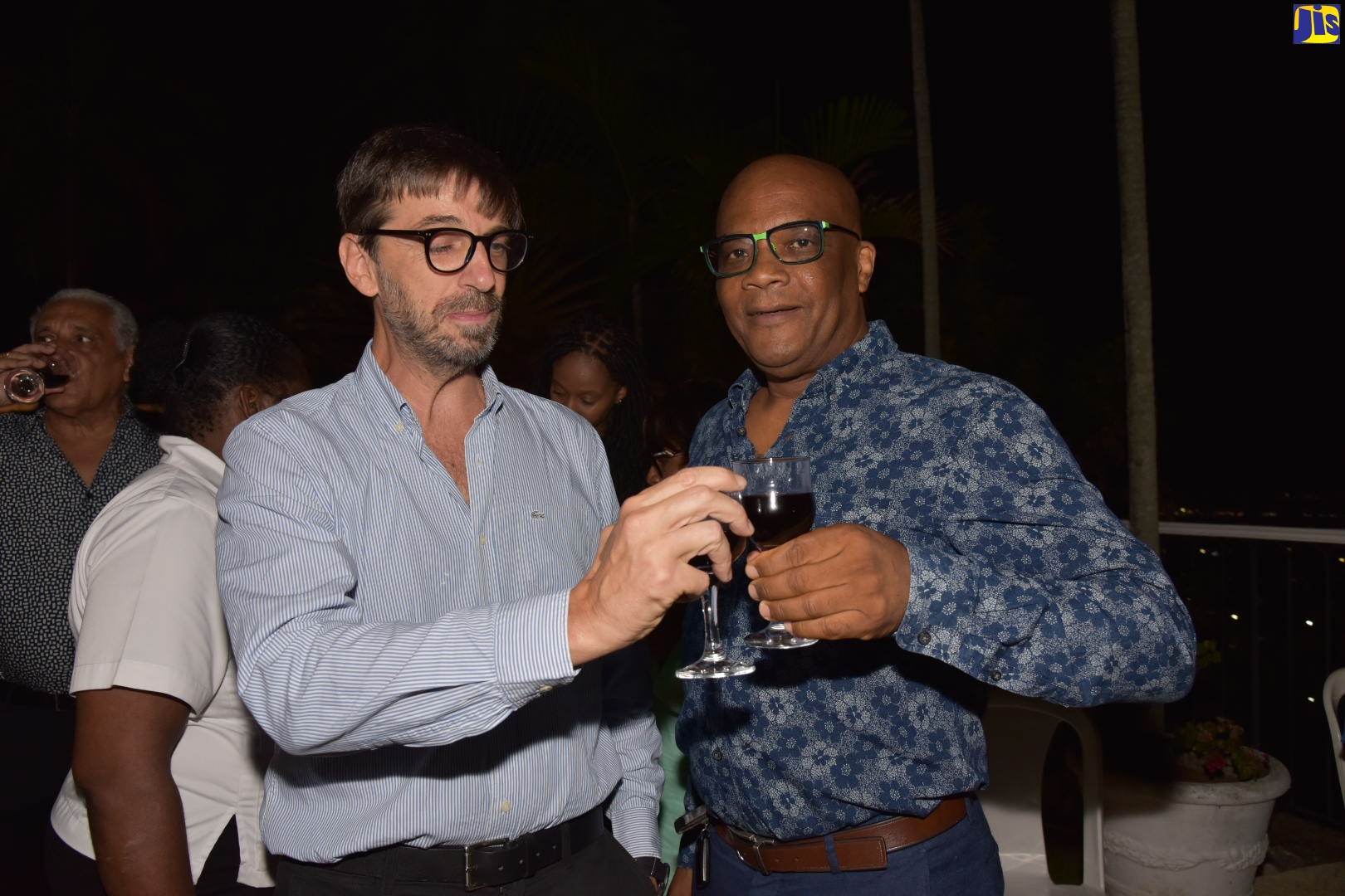 Minister of State in the Ministry of Foreign Affairs and Foreign Trade, Senator the Hon. Leslie Campbell (right), raises a toast with outgoing Ambassador of Argentina to Jamaica, His Excellency Luis del Solar, during a farewell cocktail reception for the diplomat, at 6 Brenmar Way in St. Andrew on Tuesday (July 12).