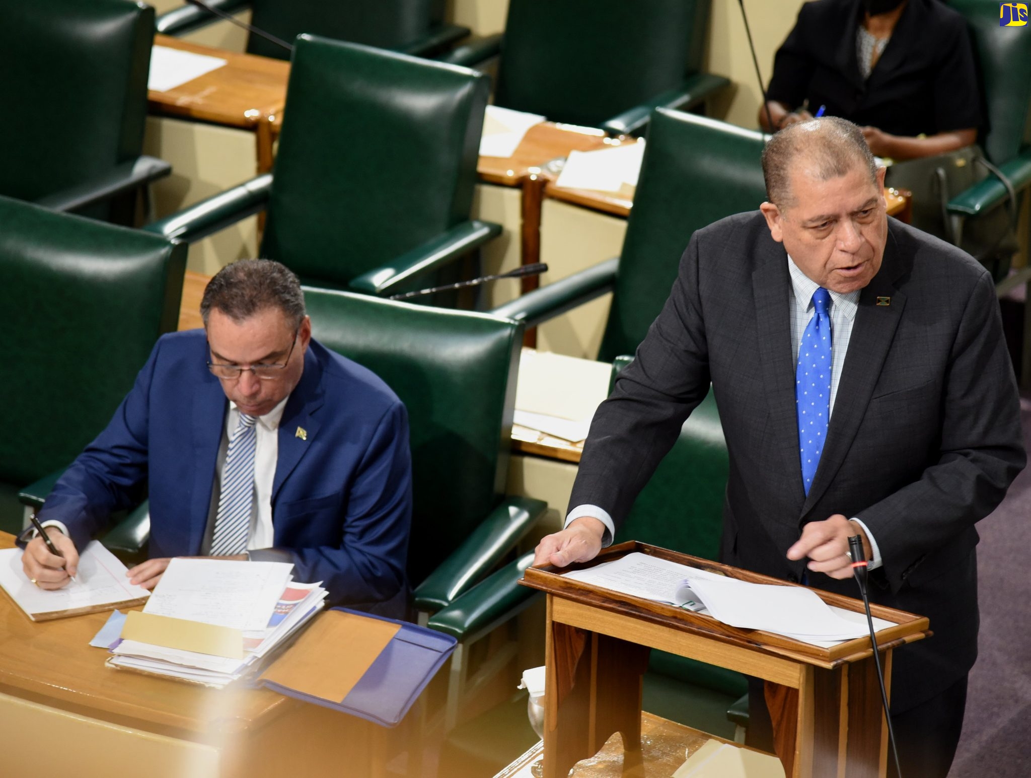 Minister of Transport and Mining, Hon. Audley Shaw, addresses the House of Representatives on July 5. At left is Minister of Science, Energy and Technology, Hon. Daryl Vaz.