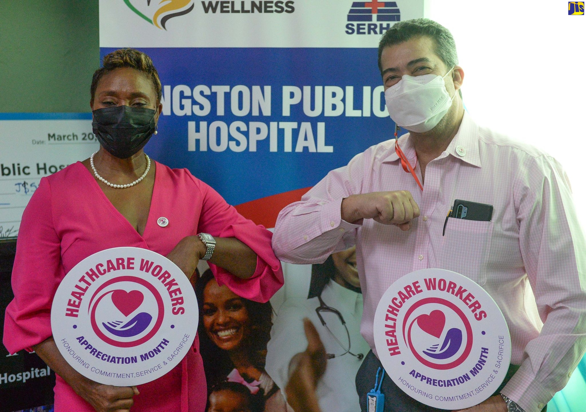 State Minister in the Ministry of Health and Wellness, Hon. Juliet Cuthbert-Flynn (left), shares a moment with Senior Medical Officer at the Kingston Public Hospital (KPH) Dr. Konrad Lawson prior to the start of the Healthcare Workers Appreciation Month badge-pinning ceremony at the Victoria Jubilee Hospital (VJH) in downtown Kingston on Wednesday (July 13). The event, which recognised staff of KPH and VJH, was held to mark Healthcare Workers Appreciation Day.
