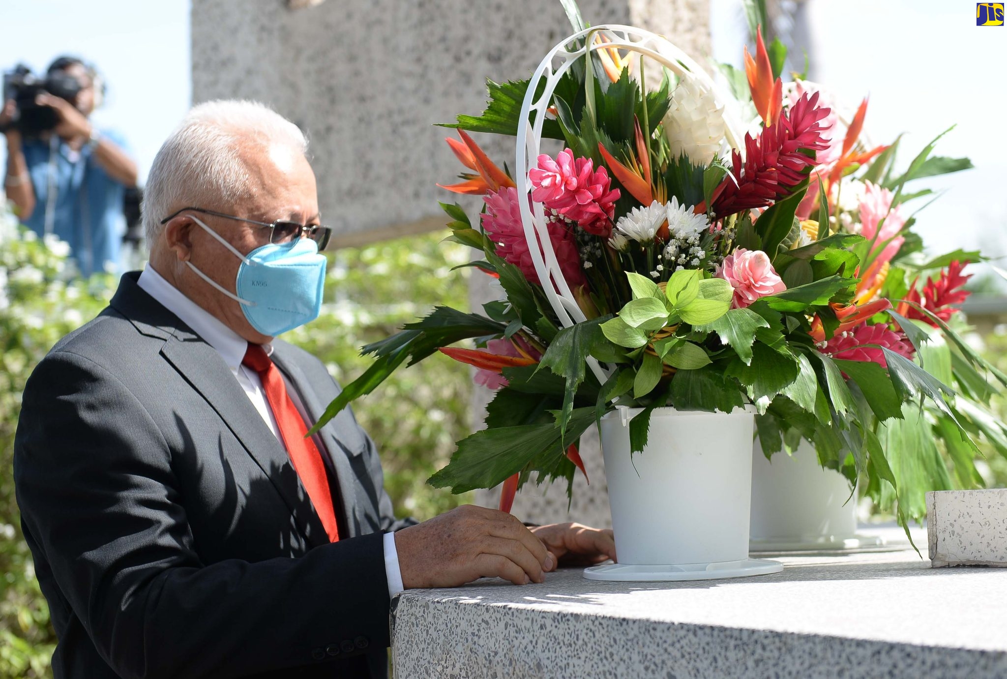 Minister of Justice, Hon. Delroy Chuck, lays a bouquet of flowers to mark the 129th anniversary of the birth of National Hero, the Rt. Excellent Norman Manley, at National Heroes Park in Kingston on Monday (July 4).