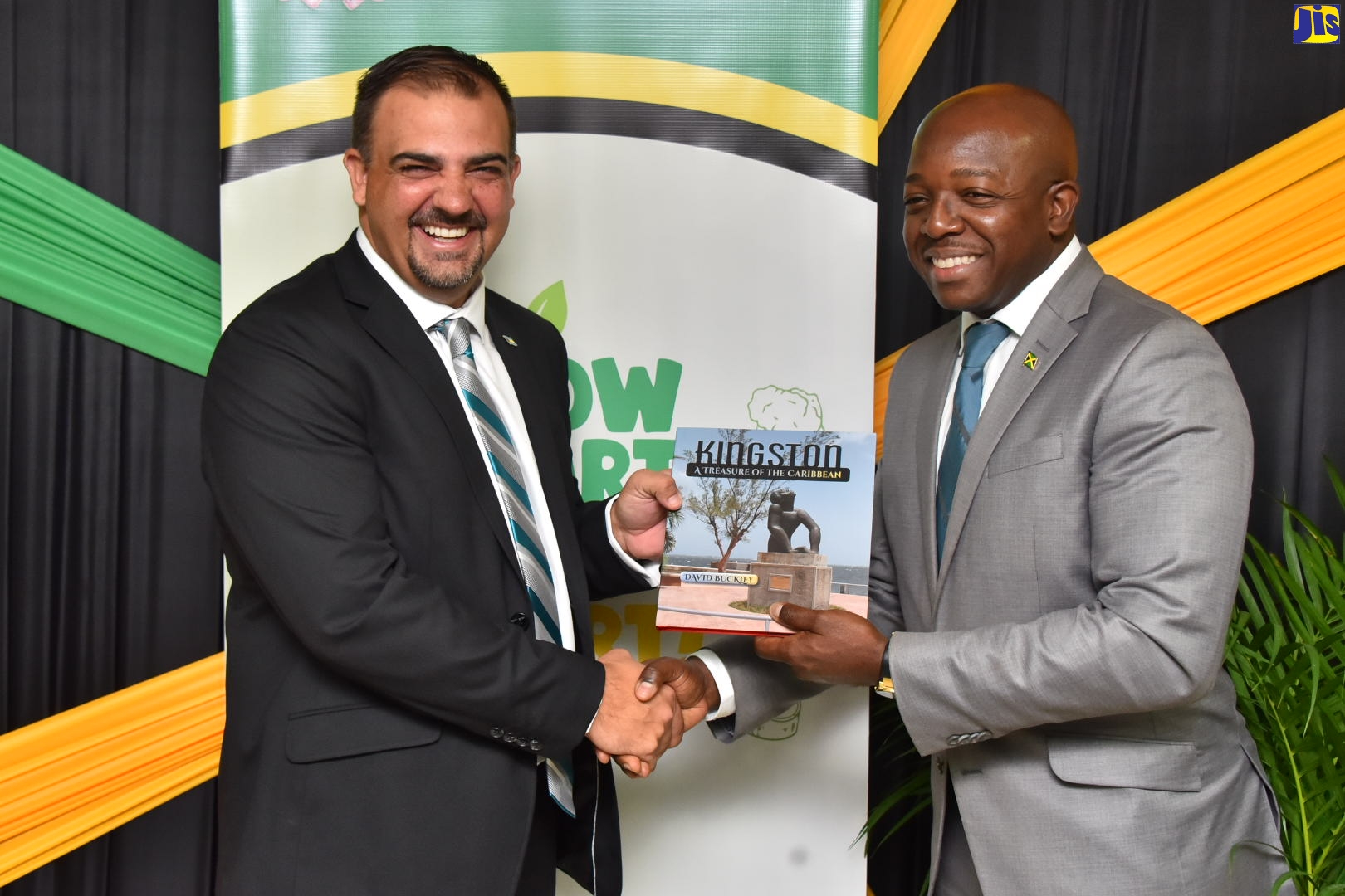 Minister of Agriculture and Fisheries, Hon. Pearnel Charles Jr. (right), presents Bahamian Minister of Agriculture, Marine Resources and Family Island Affairs, Hon. Clay Sweeting, with a token during a courtesy call at the Ministry’s offices in Kingston, on Tuesday (July 26).