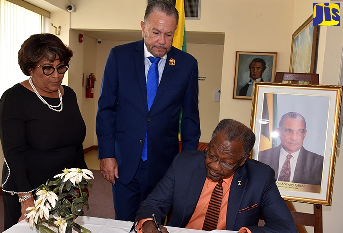 Ambassador of the United States to Jamaica, His Excellency Nick Perry signs the condolence book for late former Minister of Tourism, Francis Tulloch at Gordon House on Tuesday (July 12) . Looking on (from left) are Speaker of the House of Representatives, Hon. Marisa Dalrymple-Philibert and President of the Senate, Senator the Hon. Thomas Tavares-Finson.


