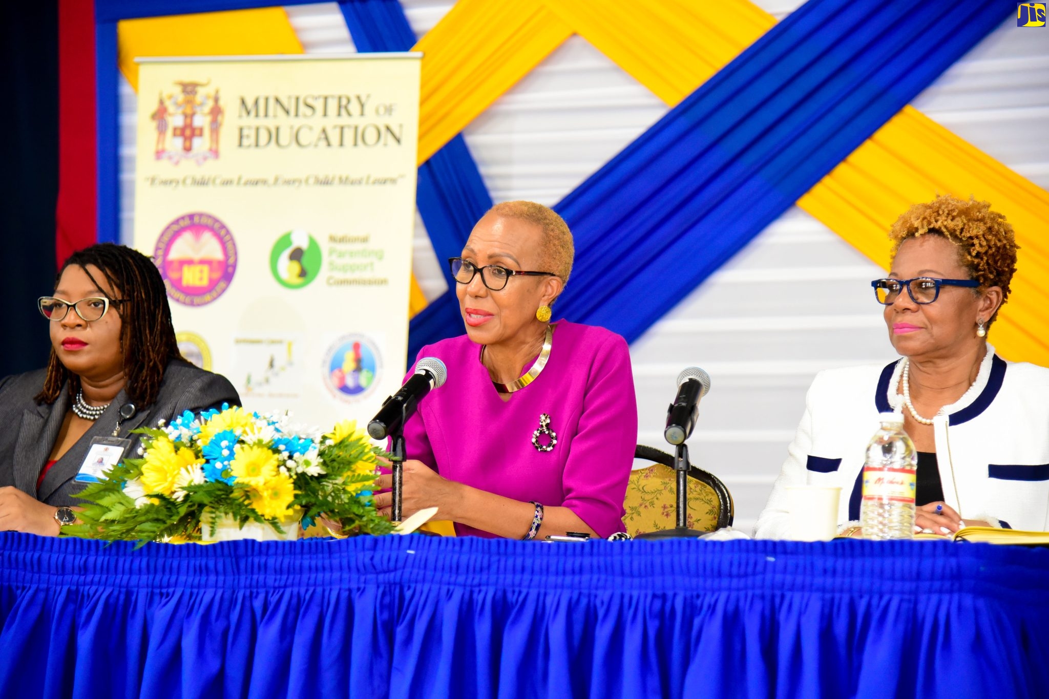 Minister of Education and Youth,  Hon. Fayval Williams (centre), fields questions during a consultation with school leaders and deans of discipline on the development of a new student dress and grooming policy at Jamaica College in Kingston on Tuesday (August 9). She is flanked by Community Relations Education Officer for the Ministry’s Region 5, Anieta Bailey (left) and Acting Permanent Secretary in the Ministry, Maureen Dwyer. 