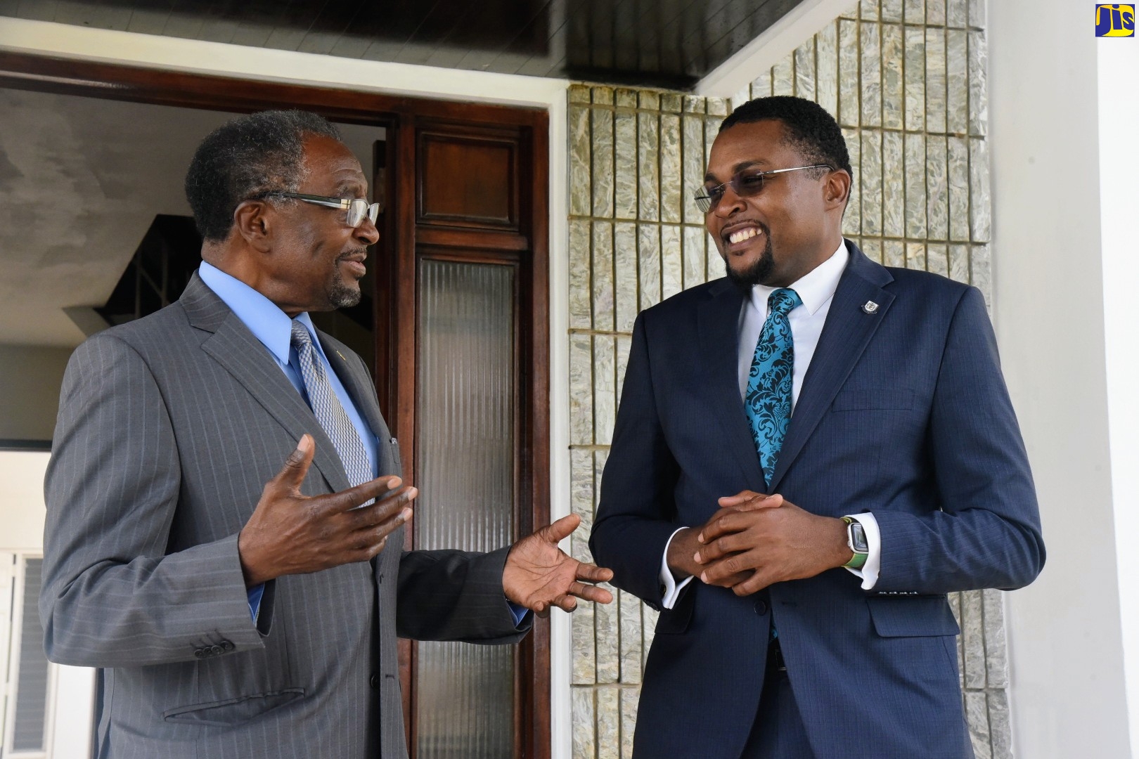 Minister without Portfolio in the Office of the Prime Minister (OPM) with responsibility for Information, Hon. Robert Morgan (right), engages in conversation with United States (US) Ambassador to Jamaica, His Excellency Nick Perry, during the diplomat
