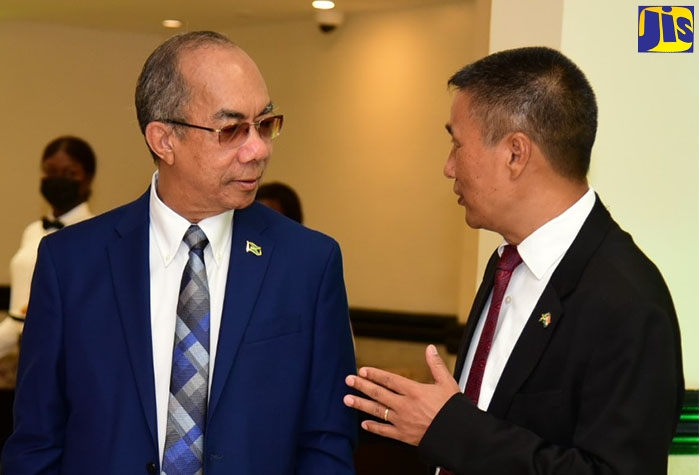 Deputy Prime Minister and Minister of National Security, Hon. Dr. Horace Chang (left), converses with High Commissioner of the Republic of India to Jamaica, His Excellency Rungsung Masakui, during Monday’s (August 15) banquet at The Jamaica Pegasus hotel in New Kingston, commemorating India’s 75th Independence Anniversary.