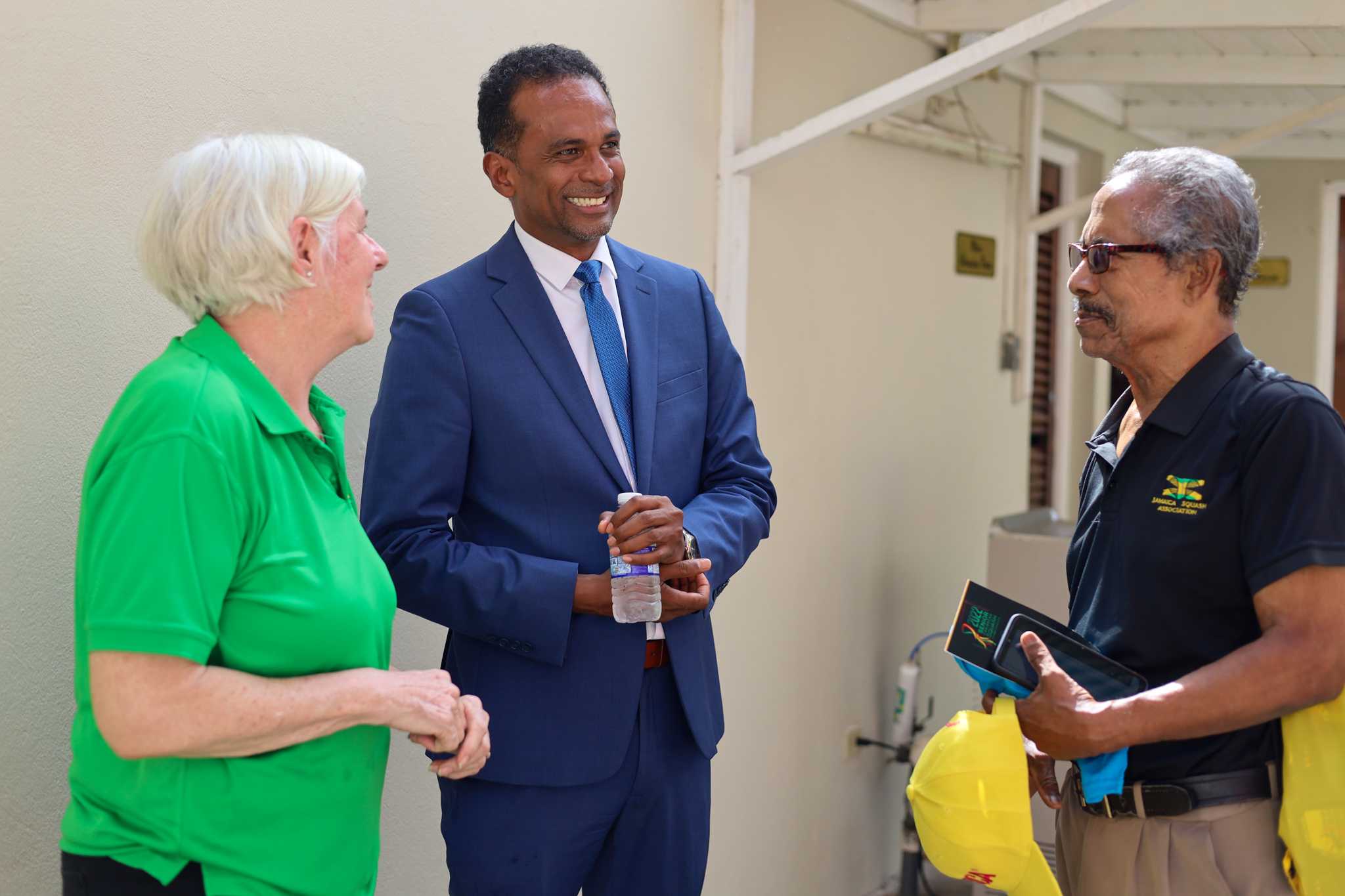 Executive Director, Tourism Enhancement Fund (TEF), Dr. Carey Wallace (centre) in dialogue with the Chairperson, 37th Senior Caribbean Squash Championships, Gill Binnie (left) and Jamaica’s Squash Team Manager, Douglas Beckford at the launch of the tournament held at the Liguanea Club in Kingston on Tuesday (August 16).  