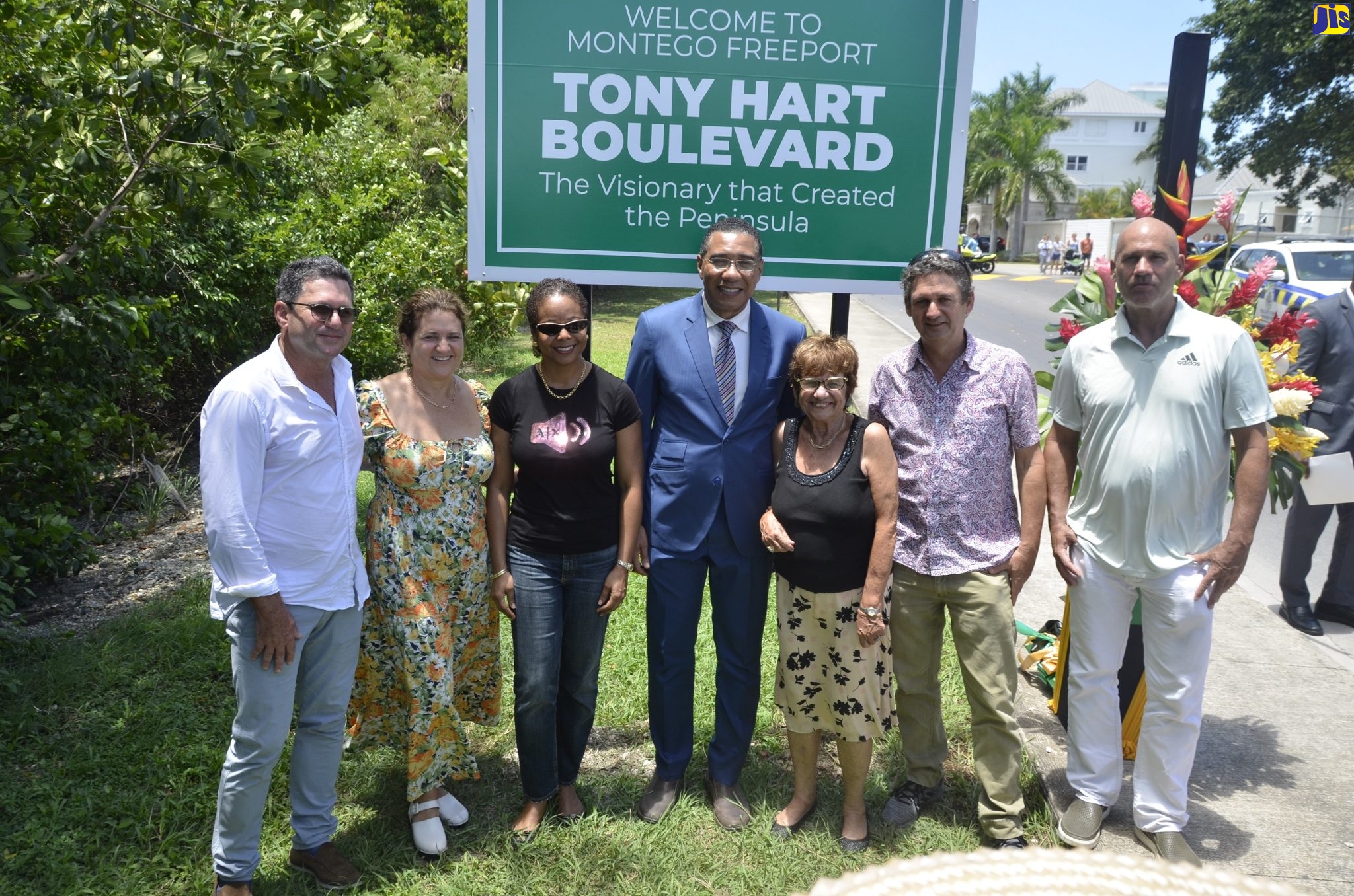 Prime Minister, the Most Hon. Andrew Holness (centre) and Minister of Legal and Constitutional Affairs, Hon. Marlene Malahoo Forte (third from left),  join family members of late businessman, Anthony
