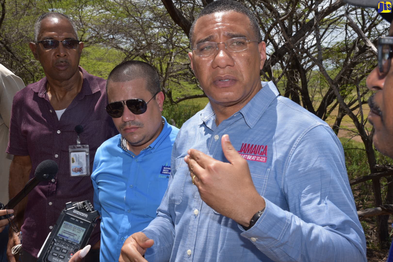 Prime Minister, the Most Hon. Andrew Holness (right) speaks with journalists following a tour of the sand dunes in Great Bay, Treasure Beach, St. Elizabeth on Friday, July 29. He is joined by (from left) Major Projects Manager at the National Works Agency (NWA), Orville Reynolds, and

Minister without portfolio in the Ministry of Economic Growth and Job Creation, Senator the Hon. Matthew Samuda.

 