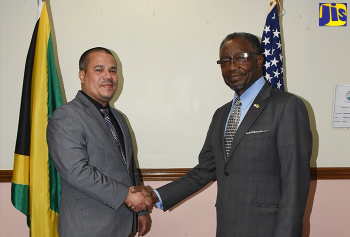Minister without Portfolio in the Ministry of Economic Growth and Job Creation, Senator the Hon. Matthew Samuda (left), greets United States Ambassador to Jamaica, His Excellency Nick Perry, during a courtesy call by the Ambassador, at the Ministry in Kingston on July 28.