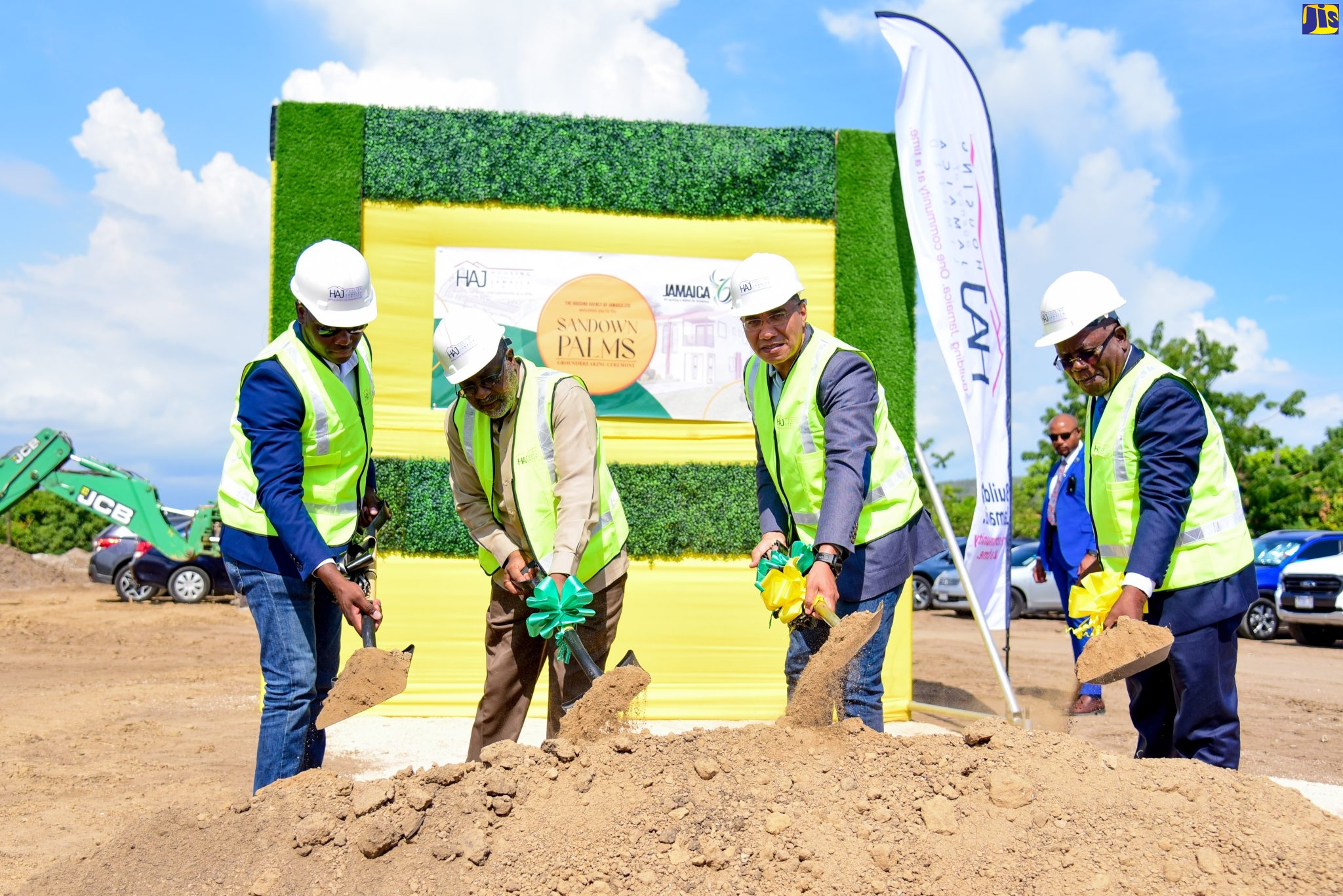 Prime Minister, the Most Hon. Andrew Holness (second right), along with (from left) Managing Director, N.F. Barnes Construction and Equipment Company Limited, Keon Hinds, Member of Parliament for St. Catherine Southern, Fitz Jackson, and Vice Chairman, Board of Directors, Housing Agency of Jamaica Limited, Sylvester Tulloch, break ground for the construction of the Sandown Palms housing development in St. Catherine, on Friday (August 26).