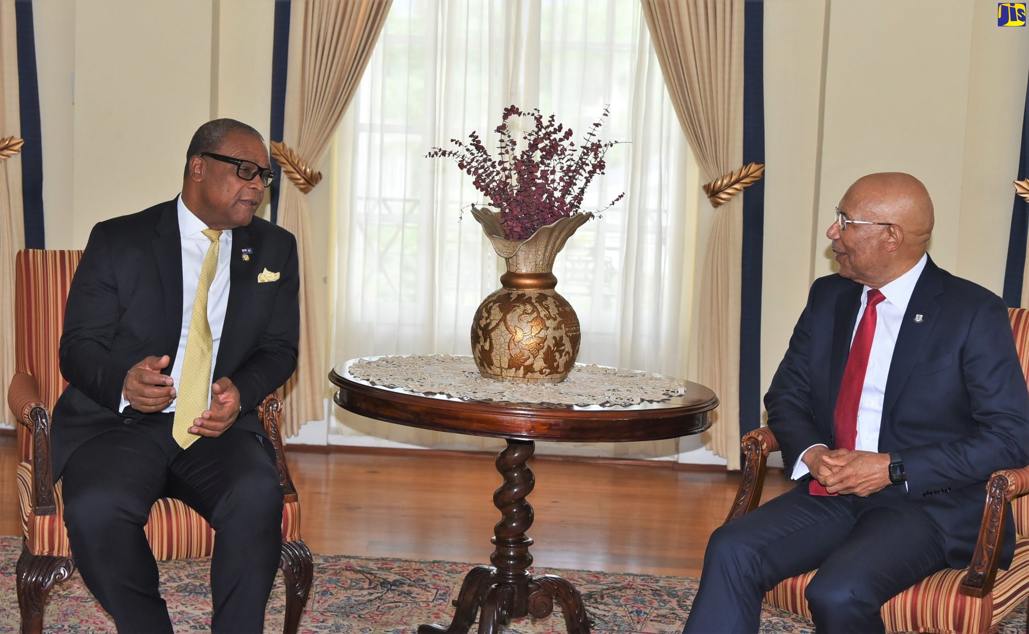 Governor-General, His Excellency the Most Hon. Sir Patrick Allen (right), speaks with Premier of the Turks and Caicos Islands, Hon. Charles Washington Misick, during a courtesy call at King’s House on Tuesday (August 16). 