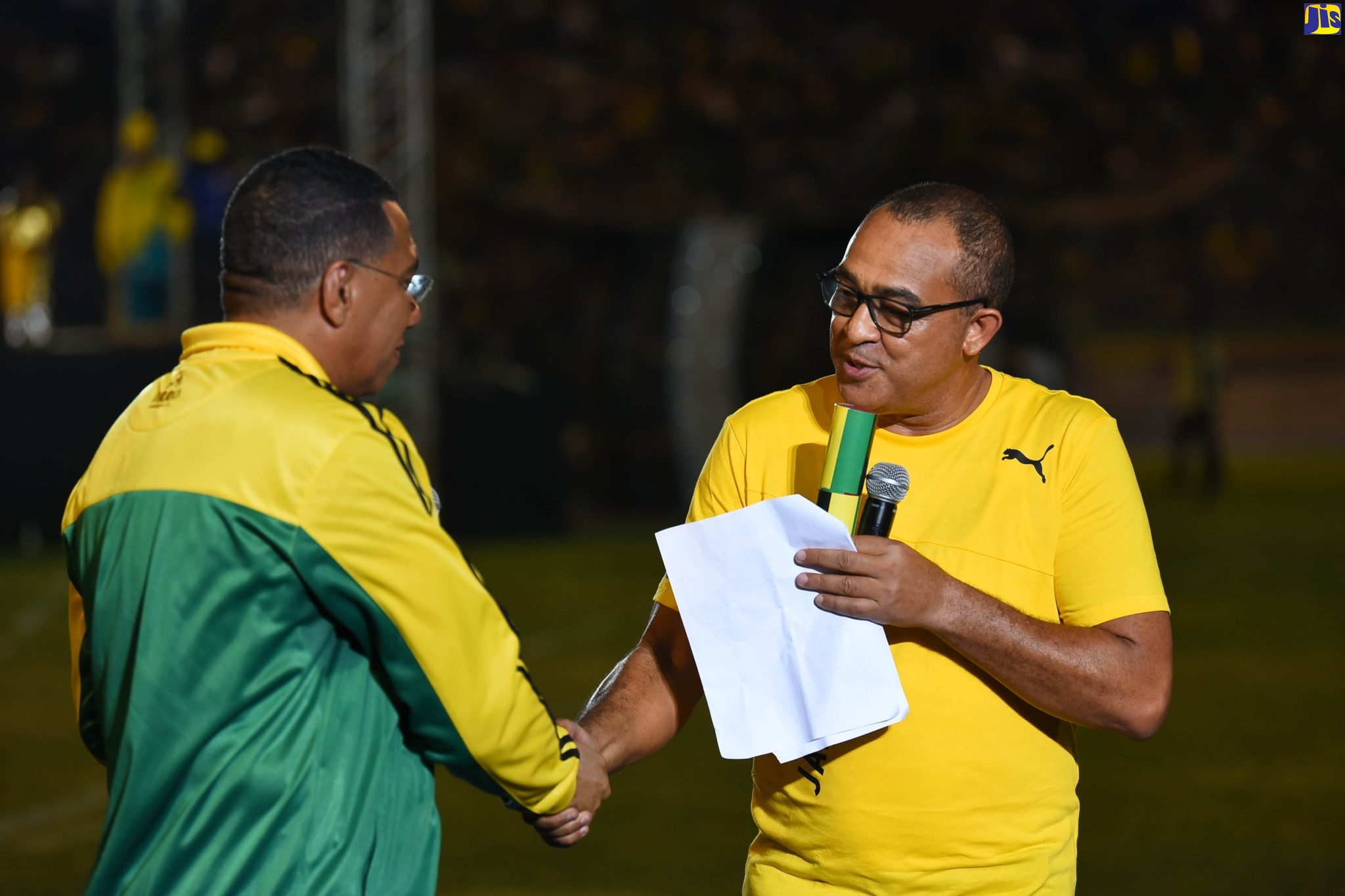 Prime Minister the Most Hon. Andrew Holness (left), shakes the hand of Minister of Health and Wellness, Dr. the Hon. Christopher Tufton, after presenting him with a citation for the recognition of healthcare workers, during the staging of the Independence Day Grand Gala, held on August 6, at the National Stadium, in St. Andrew.