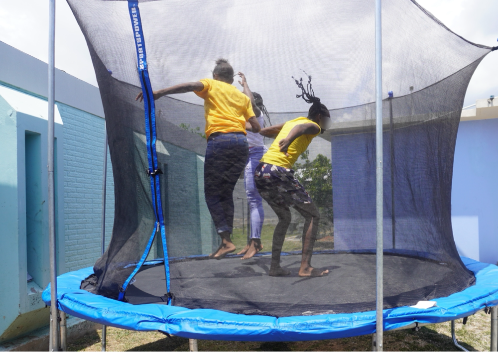 Children enjoy jumping on the trampoline at the fun day staged at the four juvenile correctional facilities to close out the annual summer programme.

