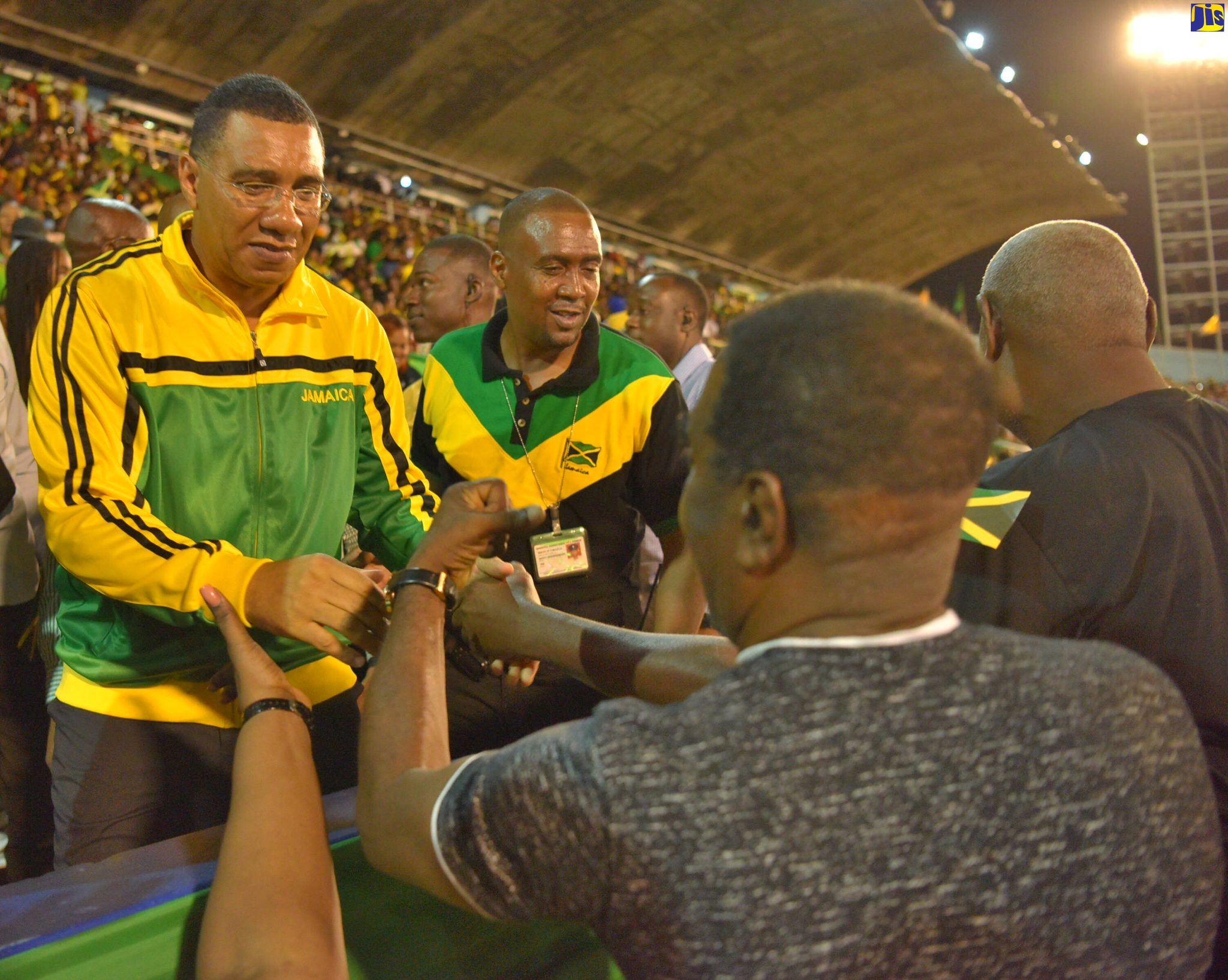 Prime Minister, the Most Hon. Andrew Holness (left), greets members of the public, during the Jamaica 60 Independence Grand Gala at the National Stadium in Kingston on August 6.