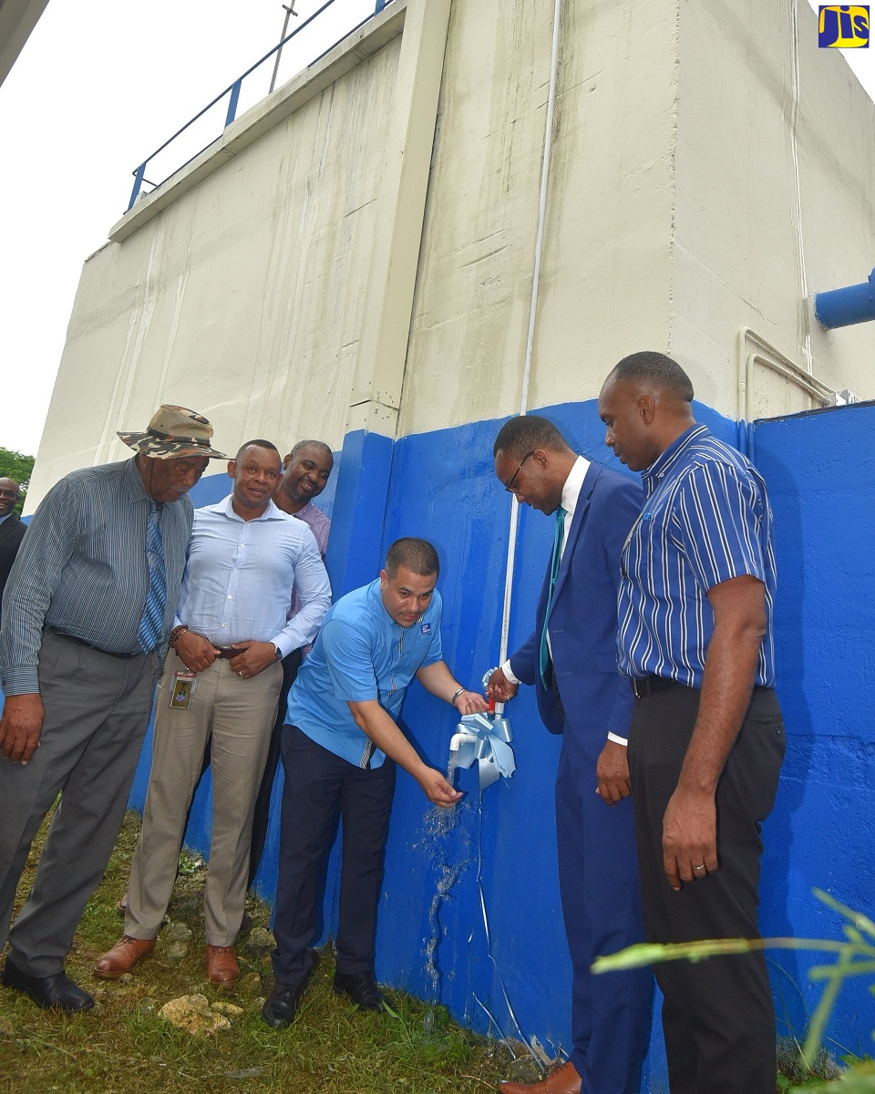Minister without Portfolio in the Ministry of Economic Growth and Job Creation, Senator, the Hon. Matthew Samuda (fourth from left), turns on a pipe during the commissioning of the $475 million Nonpareil/Retirement/Orange Hill water System in Westmoreland on Thursday (August 25). Sharing the moment (from left) are Mayor of Savanna-la-Mar, Councillor Bertel Moore; Vice President of Operations, National Water Commission (NWC), Kevin Kerr; Councillor/Caretaker, Negril Division, Owen James; Member of Parliament, Westmoreland Western, Morland Wilson; and NWC Regional Manager for Westmoreland and Hanover, Jeffrey Smith.