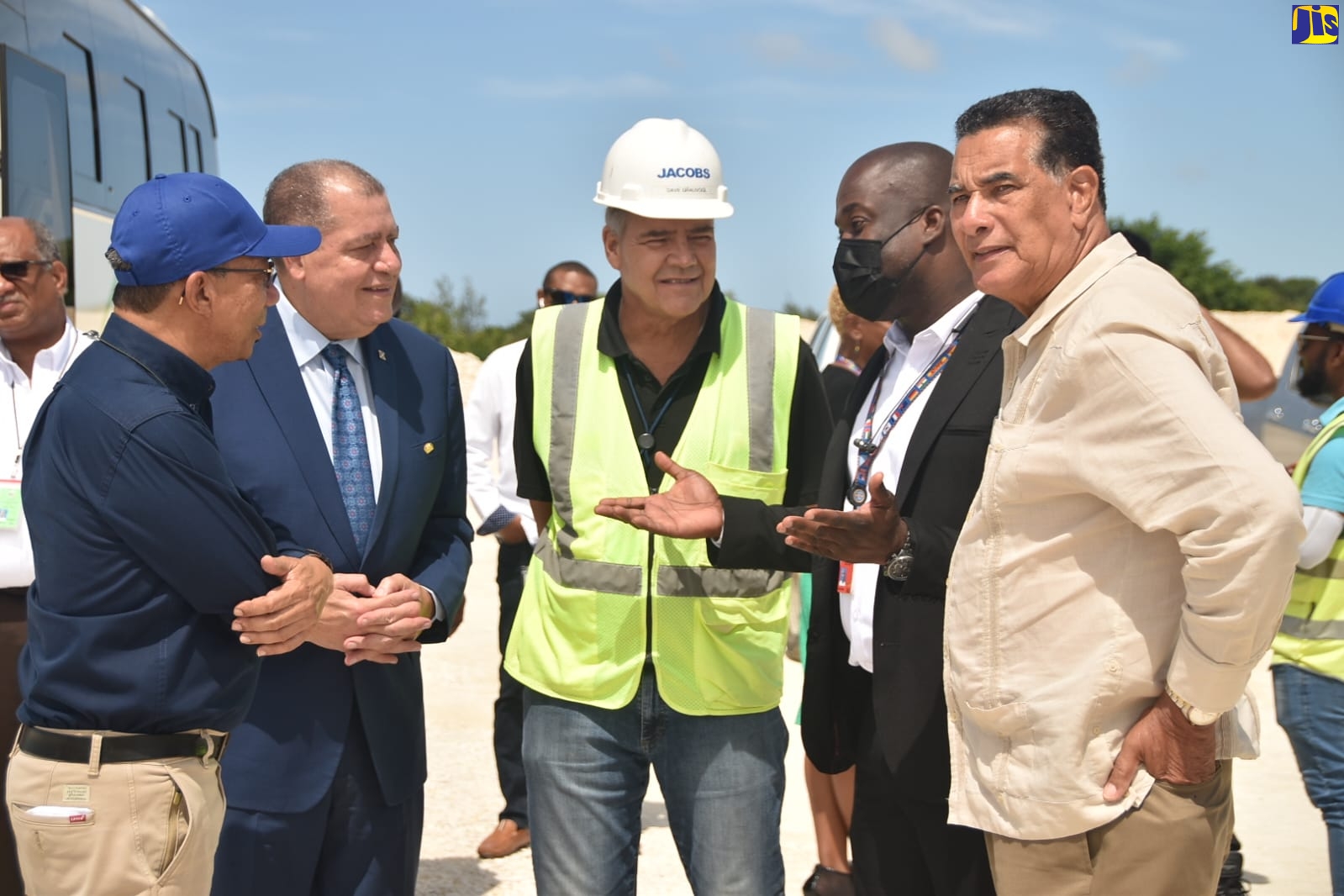 Minister of National Security, Hon. Dr. Horace Chang (left), and Minister of Transport and Mining, Hon. Audley Shaw (second left) listen to Chief Executive Officer (CEO) of MBJ Limited, Shane Munroe (fourth left), during a tour of the Sangster International Airport in Montego Bay, on August 18. Also on the tour are (from left) Representative for Jacob/Leighfisher, Engineer, David Grauvogl, and Minister of State in the Office of the Prime Minister, Hon. Homer Davis.