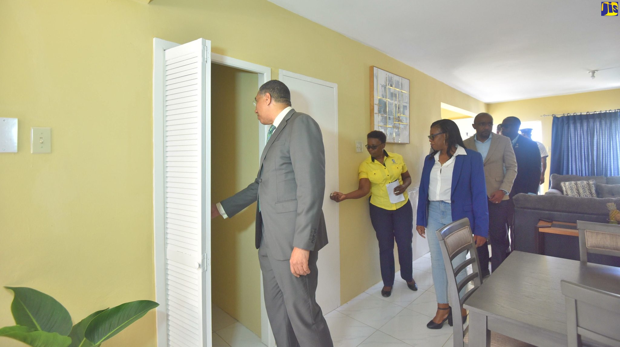 Prime Minister the Most Hon. Andrew Holness (left) inspects one of the new National Housing Trust (NHT) houses along with other stakeholders at the handing over ceremony of the NHT Industry Cove Manor houses in Green Island, Hanover on Friday (August 12).  
