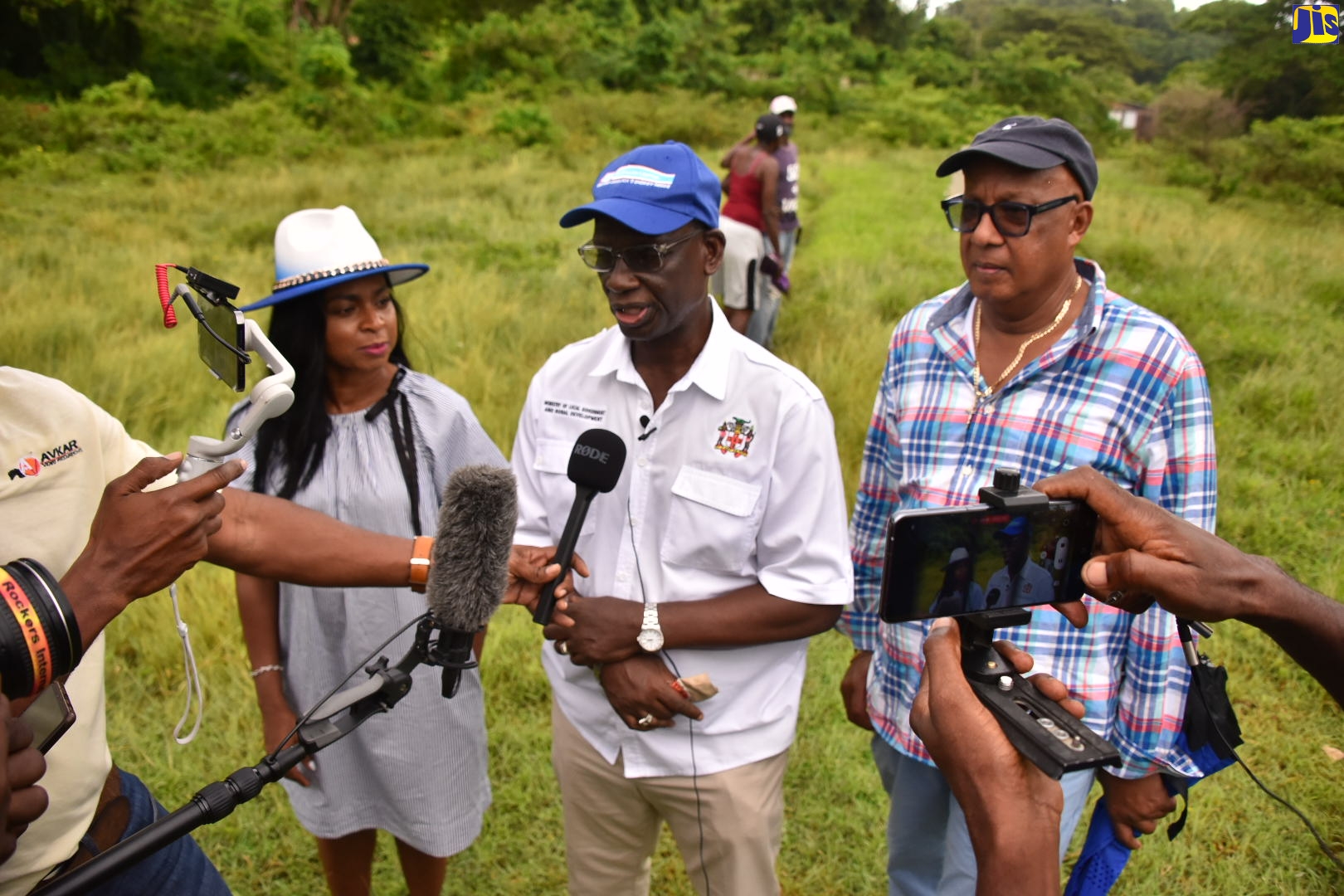 Minister of Local Government and Rural Development, Hon. Desmond McKenzie, speaks with journalists following a tour of the Cheswick community in St Thomas, on August 30. The community is next to benefit from a series of upgrades under the Rural Development Programme. Listening to the Minister (from left) are Member of Parliament, St. Thomas Eastern, Dr. Michelle Charles and Councillor for the Dalvey Division, Michael McLeod.