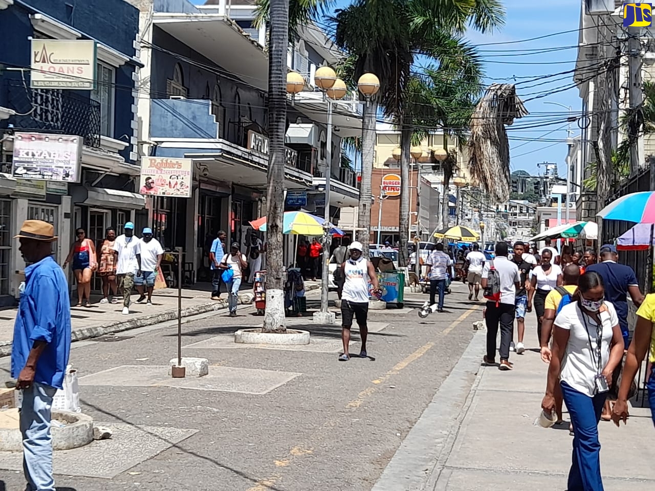 Members of the public go about their business in Montego Bay on August 15.