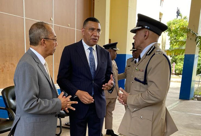 Prime Minister, the Most. Hon. Andrew Holness (centre), in discussion with Deputy Prime Minister and Minister of National Security, Hon. Dr. Horace Chang (left), and Police Commissioner, Major General Antony Anderson, at the Jamaica Constabulary Force’s (JCF) passing out parade ceremony at the National Police College of Jamaica, in Twickenham Park, St. Catherine, on September 14.  