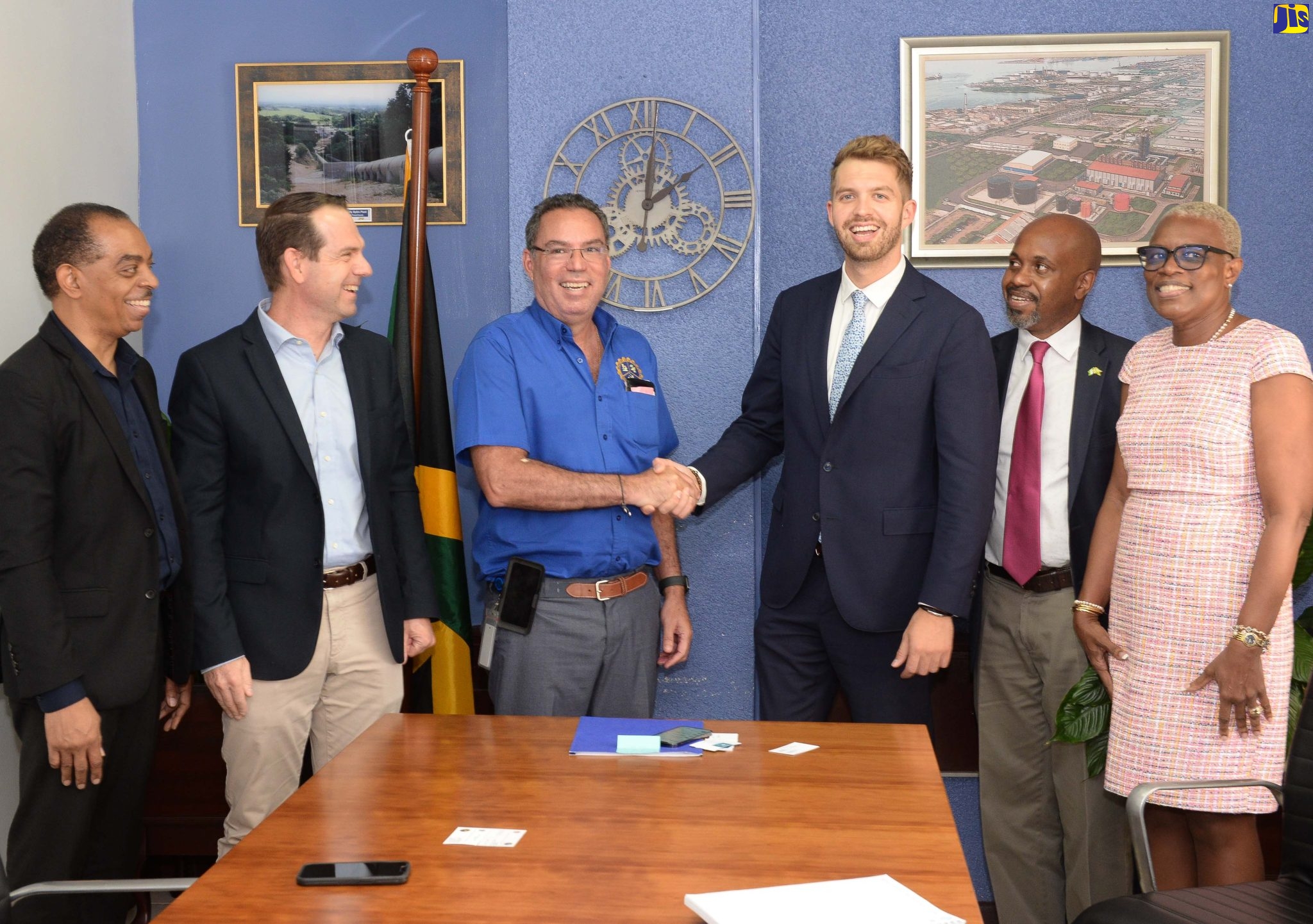 Minister of Science, Energy and Technology, Hon. Daryl Vaz (third left), shakes hands with Vice President, Hydrogene de France (HDF) Caribbean, Thibault Menage, following a courtesy call at the Ministry’s offices in Kingston on September 8. Others (from left) are Business Developer, HDF Caribbean, Dwight DaCosta, Managing Director, RUBIS Energy Jamaica, Michel Malatino, and officers at the Ministry’s Brian Richardson and Olive Cross.